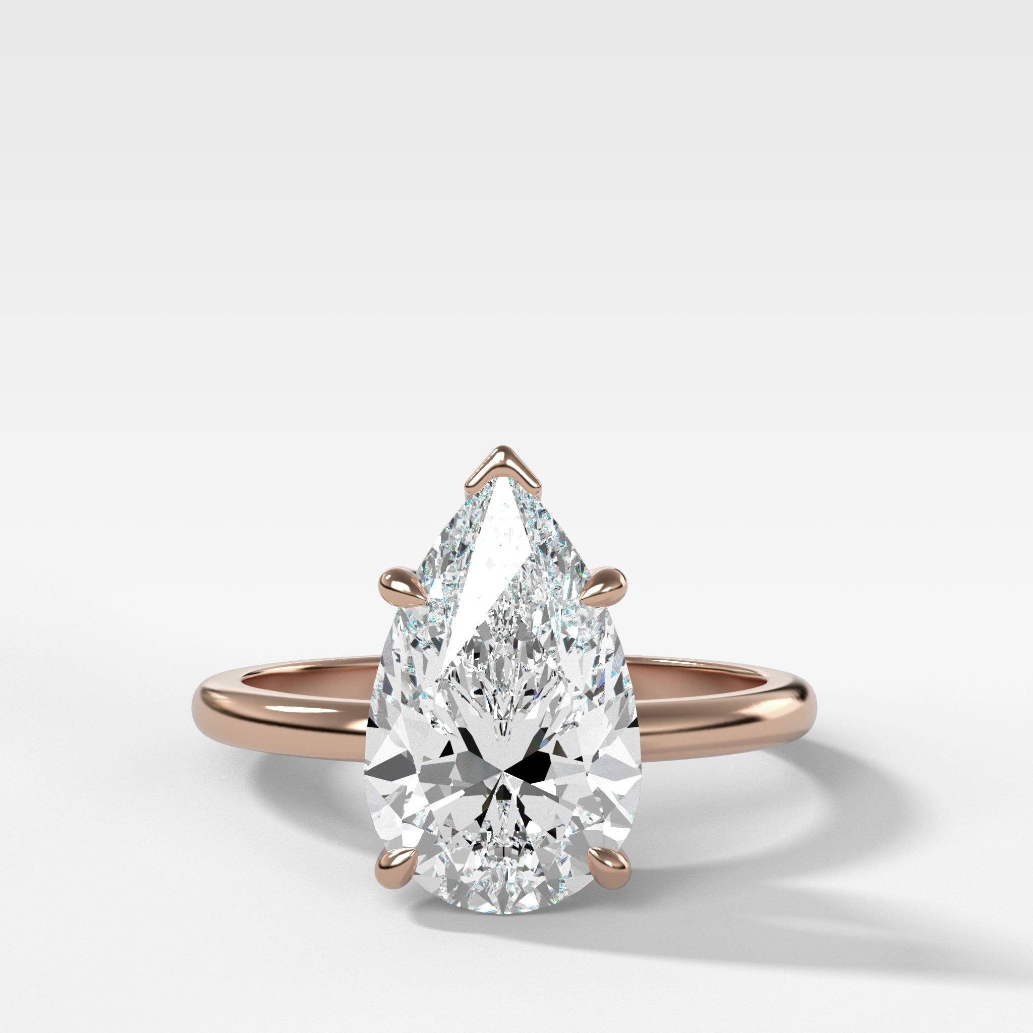 Crescent Solitaire Engagement Ring With Pear Cut Diamond