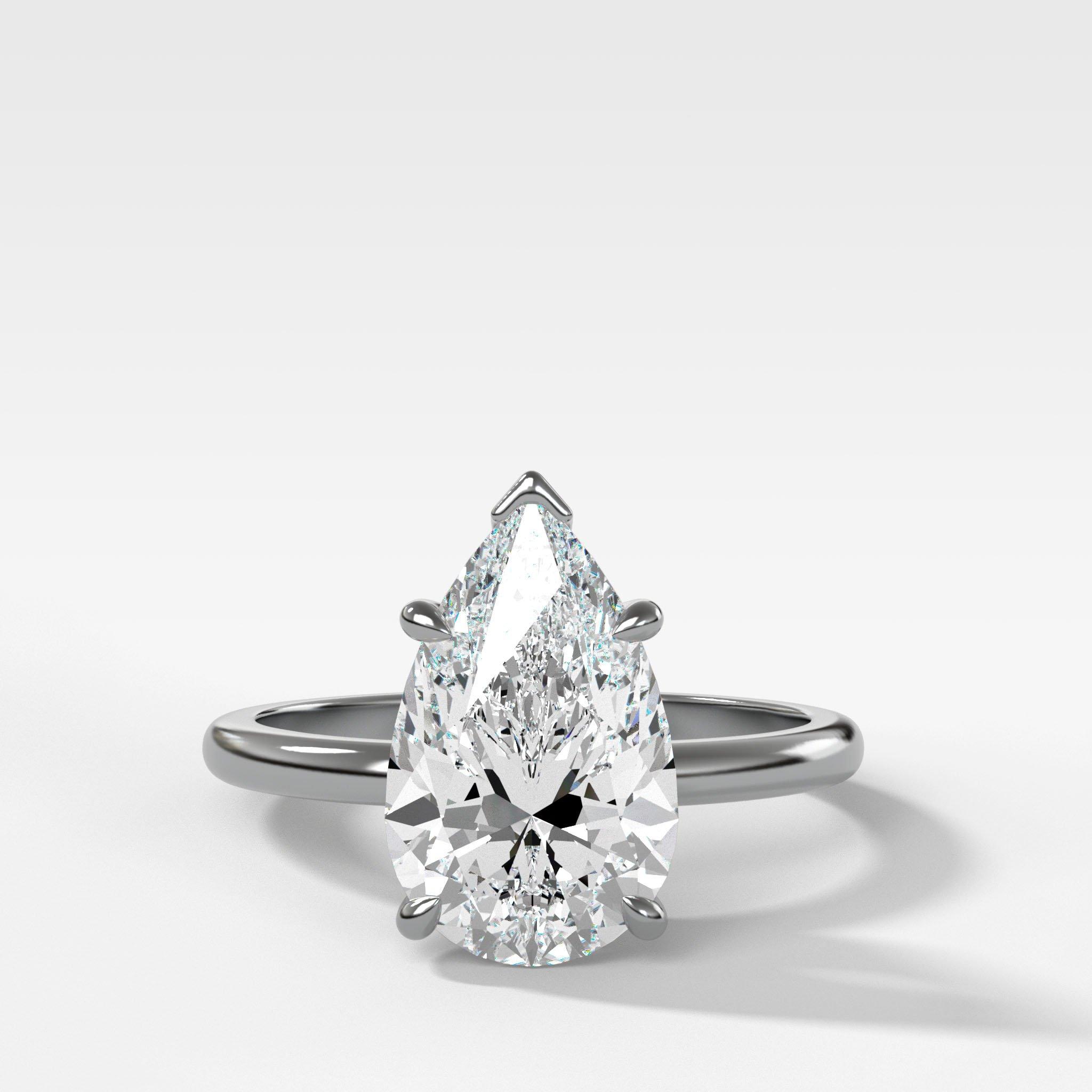 Crescent Solitaire Engagement Ring With Pear Cut Diamond