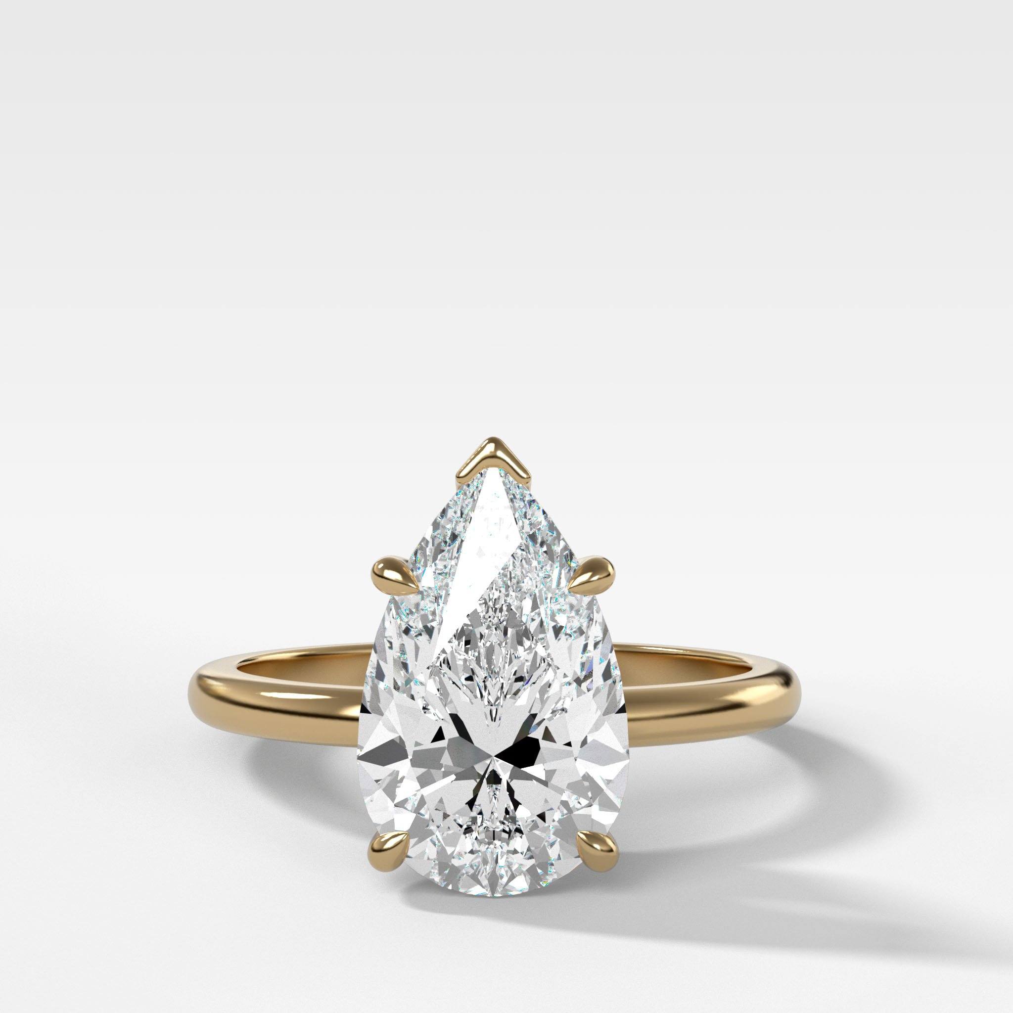 Crescent Solitaire Engagement Ring With Pear Cut Diamond