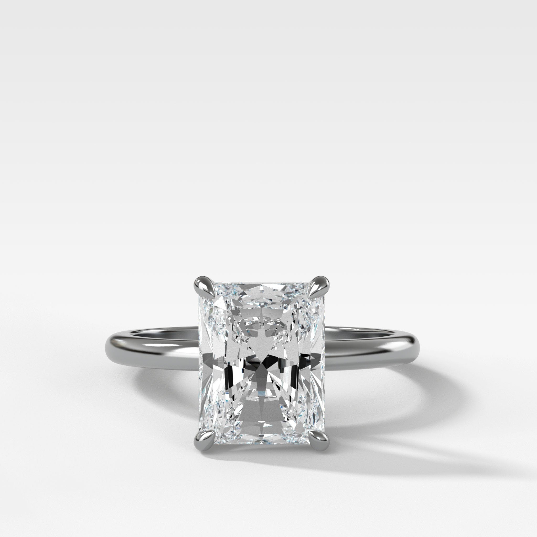 Crescent Solitaire Engagement Ring With Elongated Radiant Cut Diamond