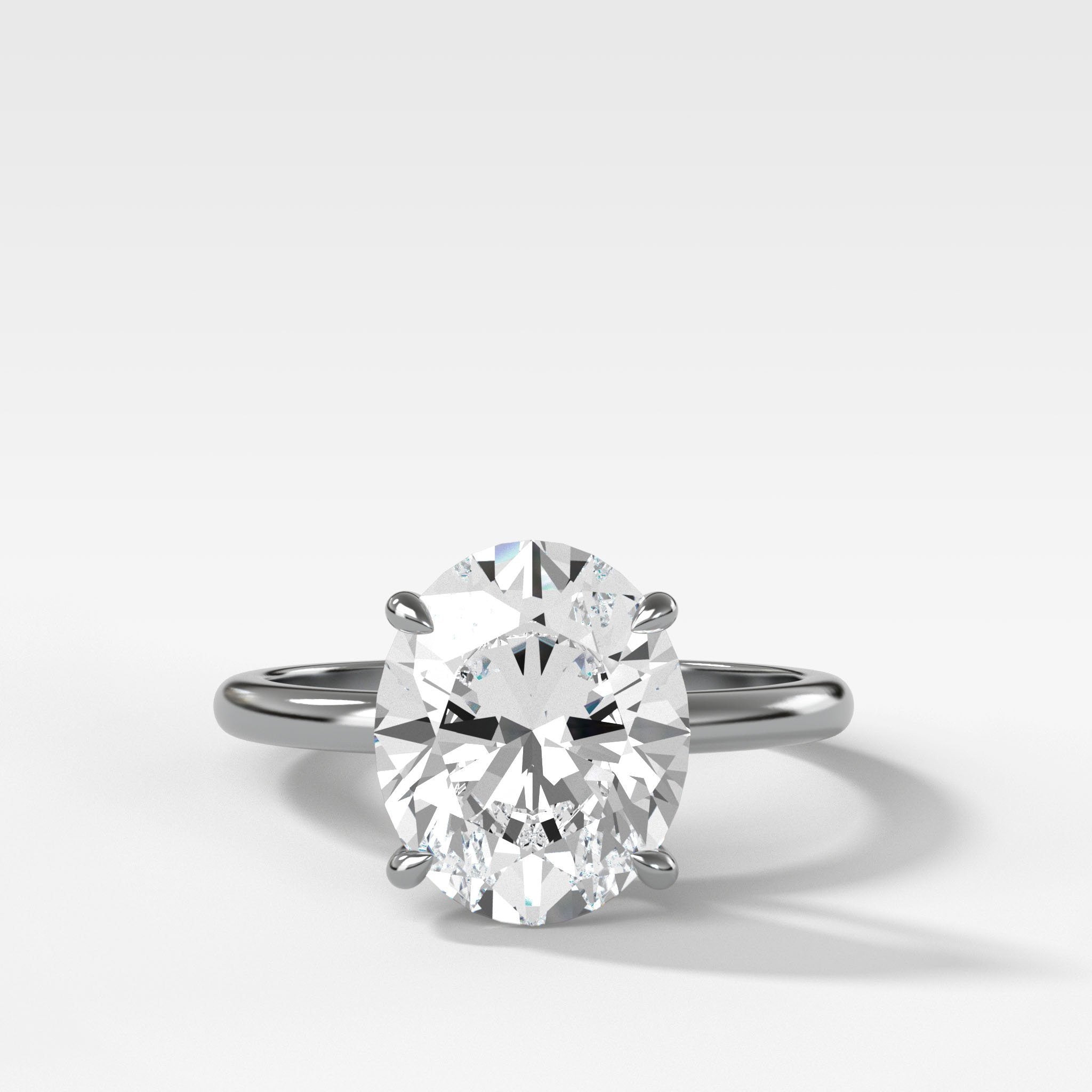 Crescent Solitaire Engagement Ring With Oval Cut Diamond
