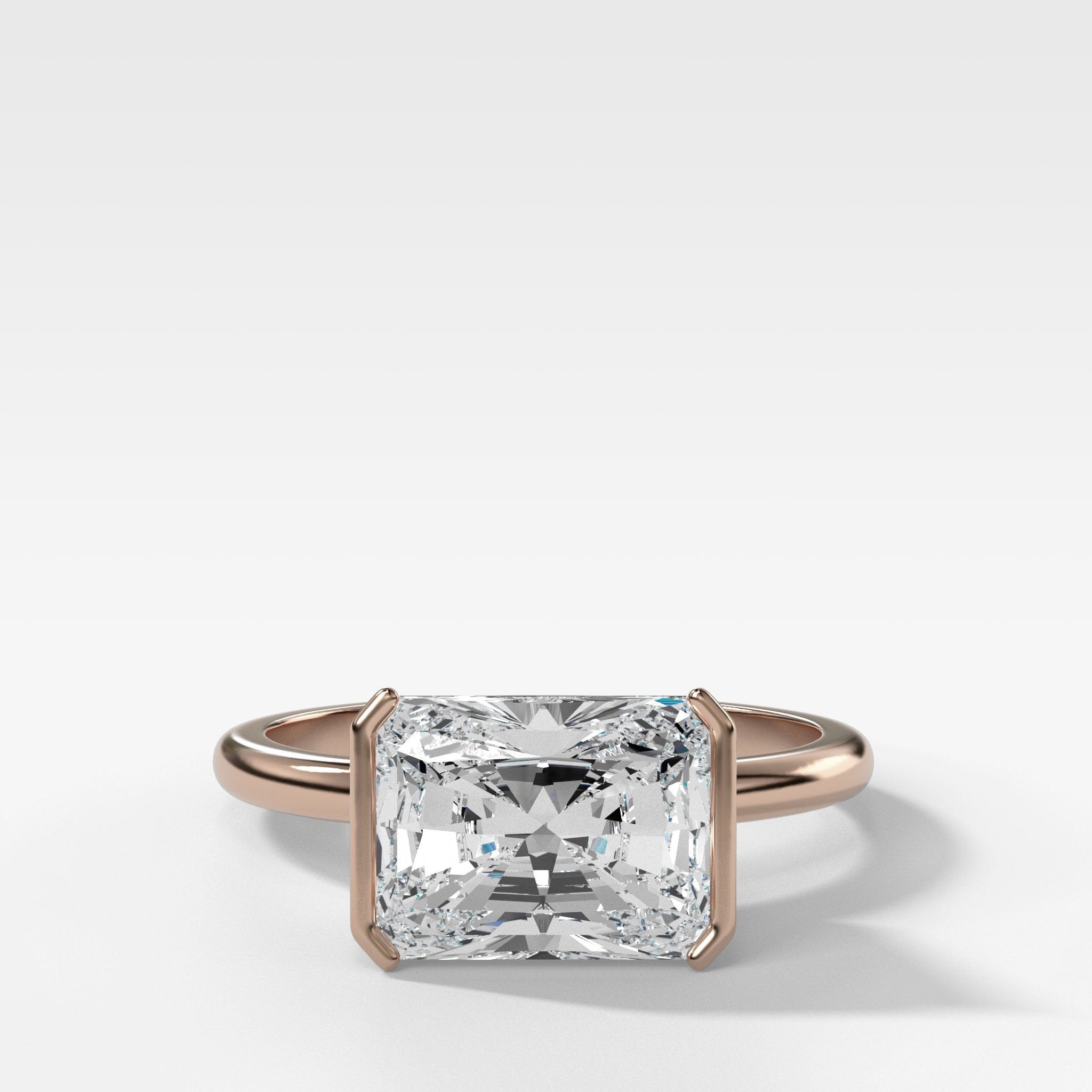 East West Half Bezel Solitaire Engagement Ring With Elongated Radiant Cut Diamond