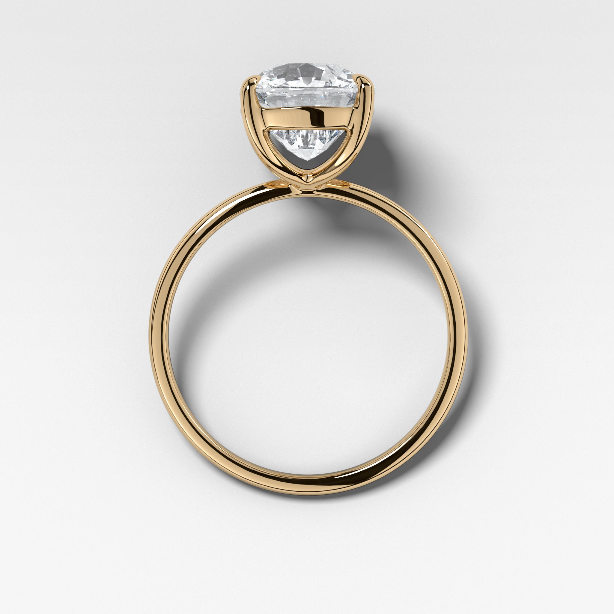 Thin + Simple Solitaire Engagement Ring With Elongated Cushion Cut Diamond