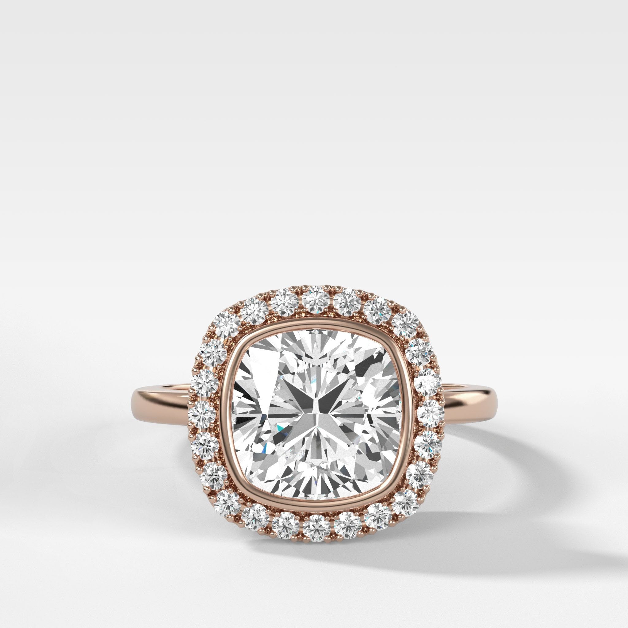 Bezel Set Halo Engagement Ring With Cushion Cut Diamond