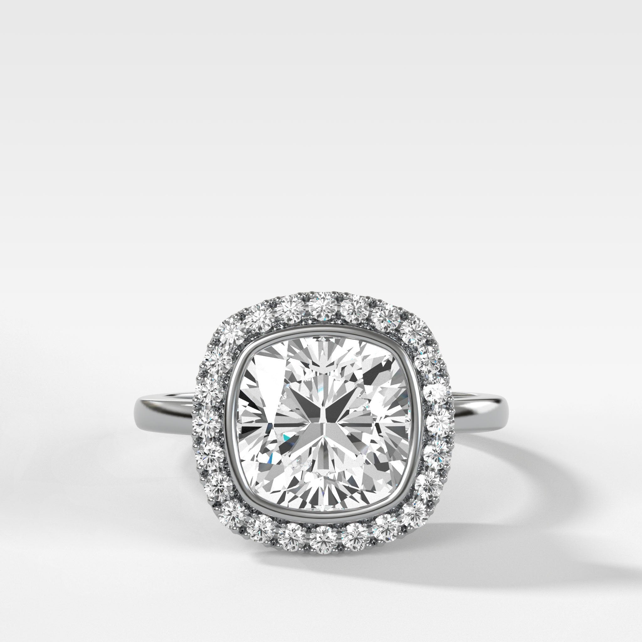 Bezel Set Halo Engagement Ring With Cushion Cut Diamond