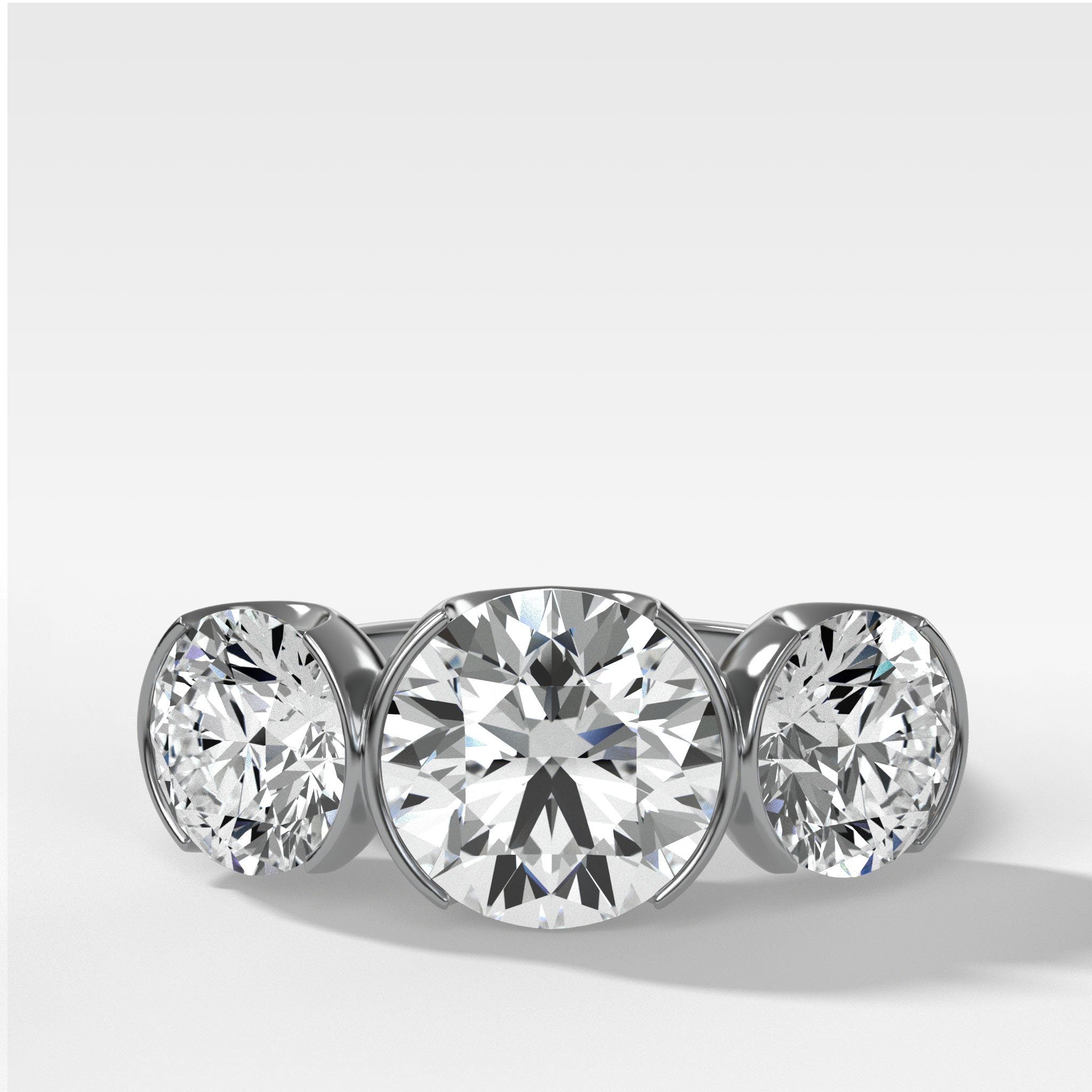 Half Bezel Triad Engagement Ring With Round Cut Diamonds