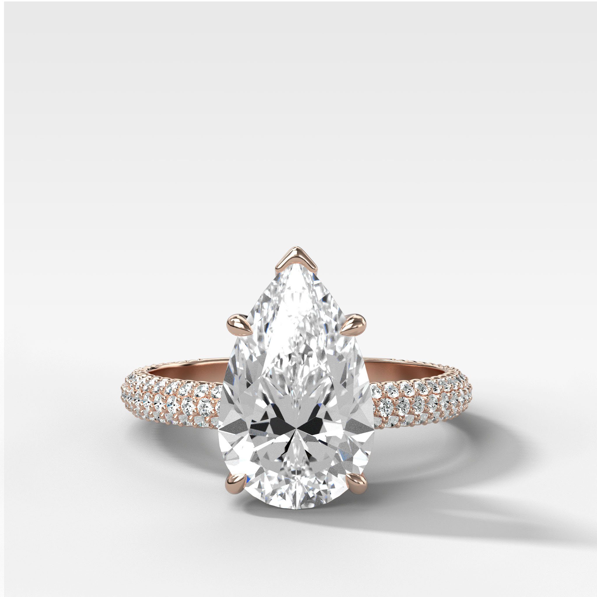Triple Row Pavé Engagement Ring With Pear Cut Diamond
