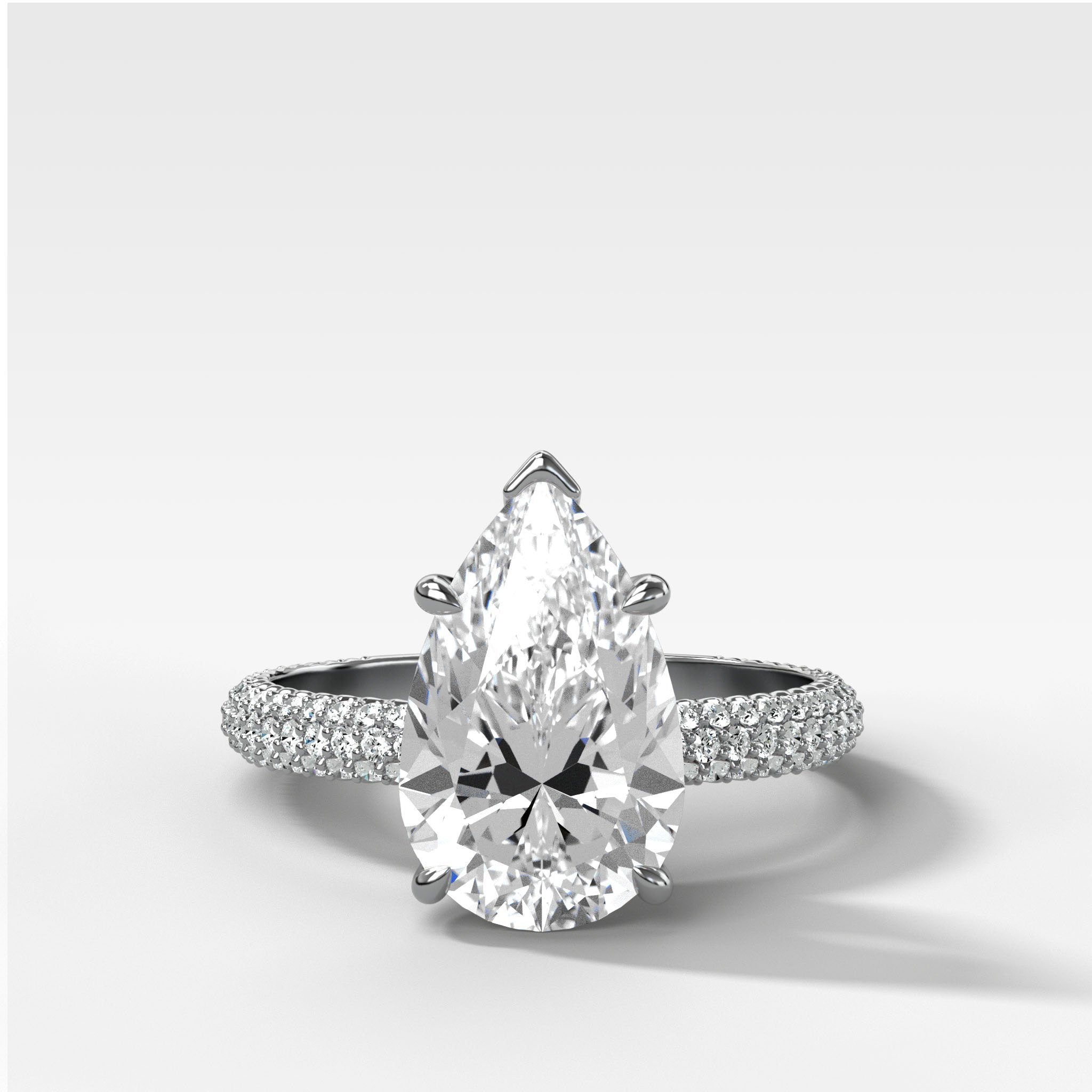 Triple Row Pavé Engagement Ring With Pear Cut Diamond