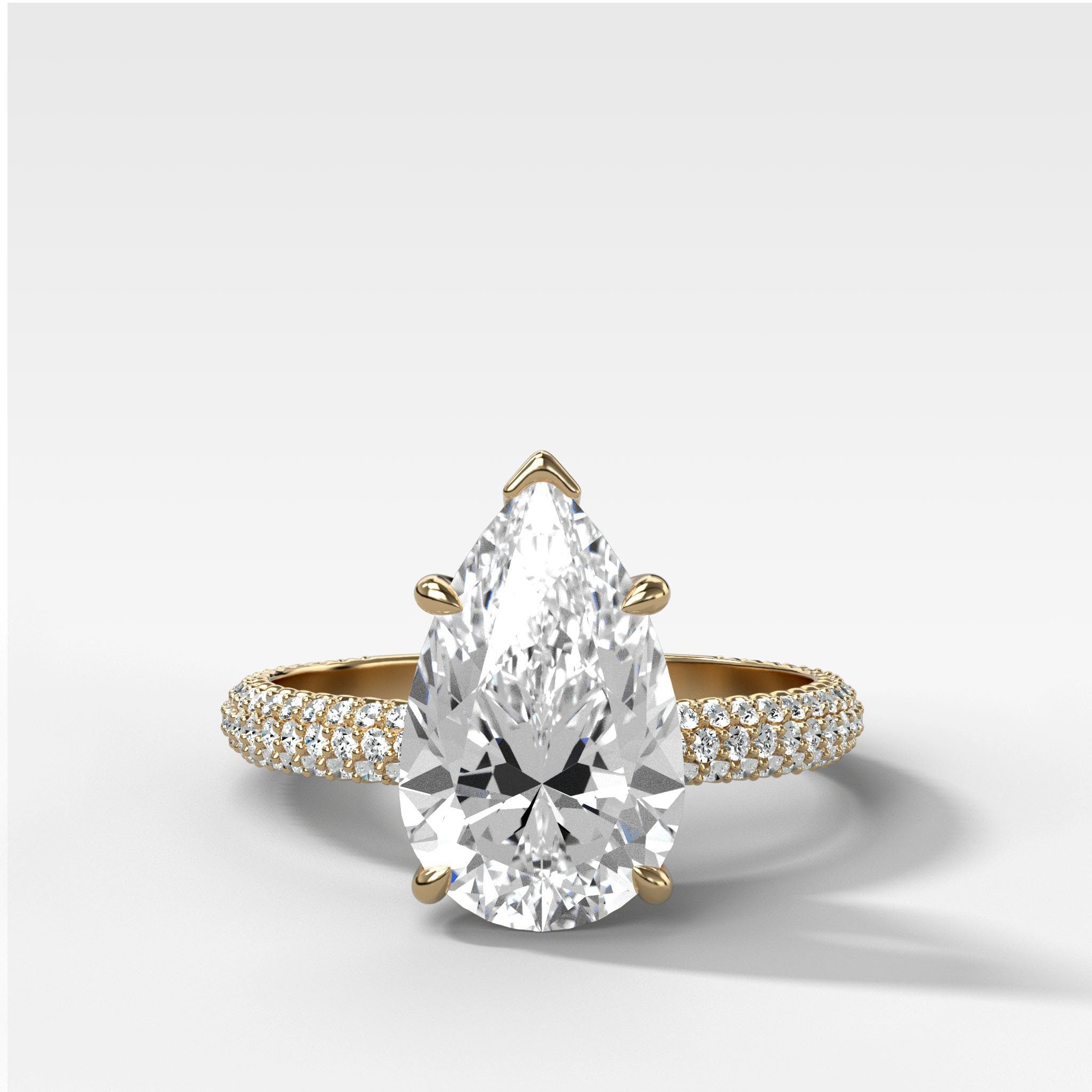Triple Row Pavé Engagement Ring With Pear Cut Diamond