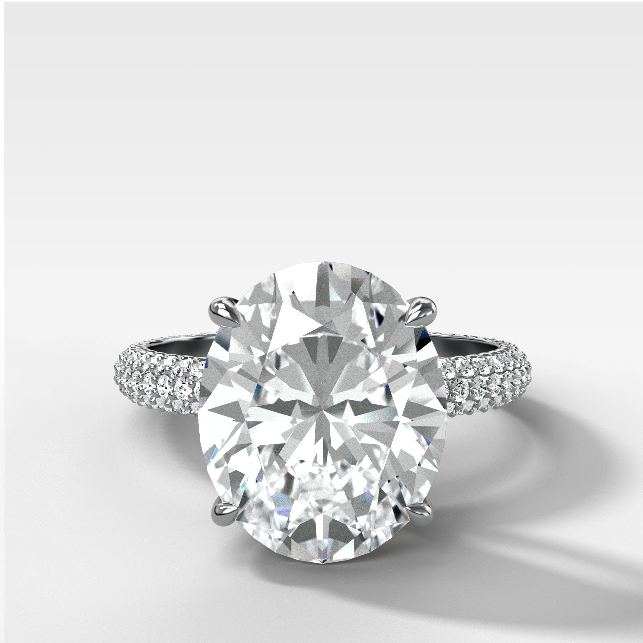 Triple Row Pavé Engagement Ring With Oval Cut Diamond