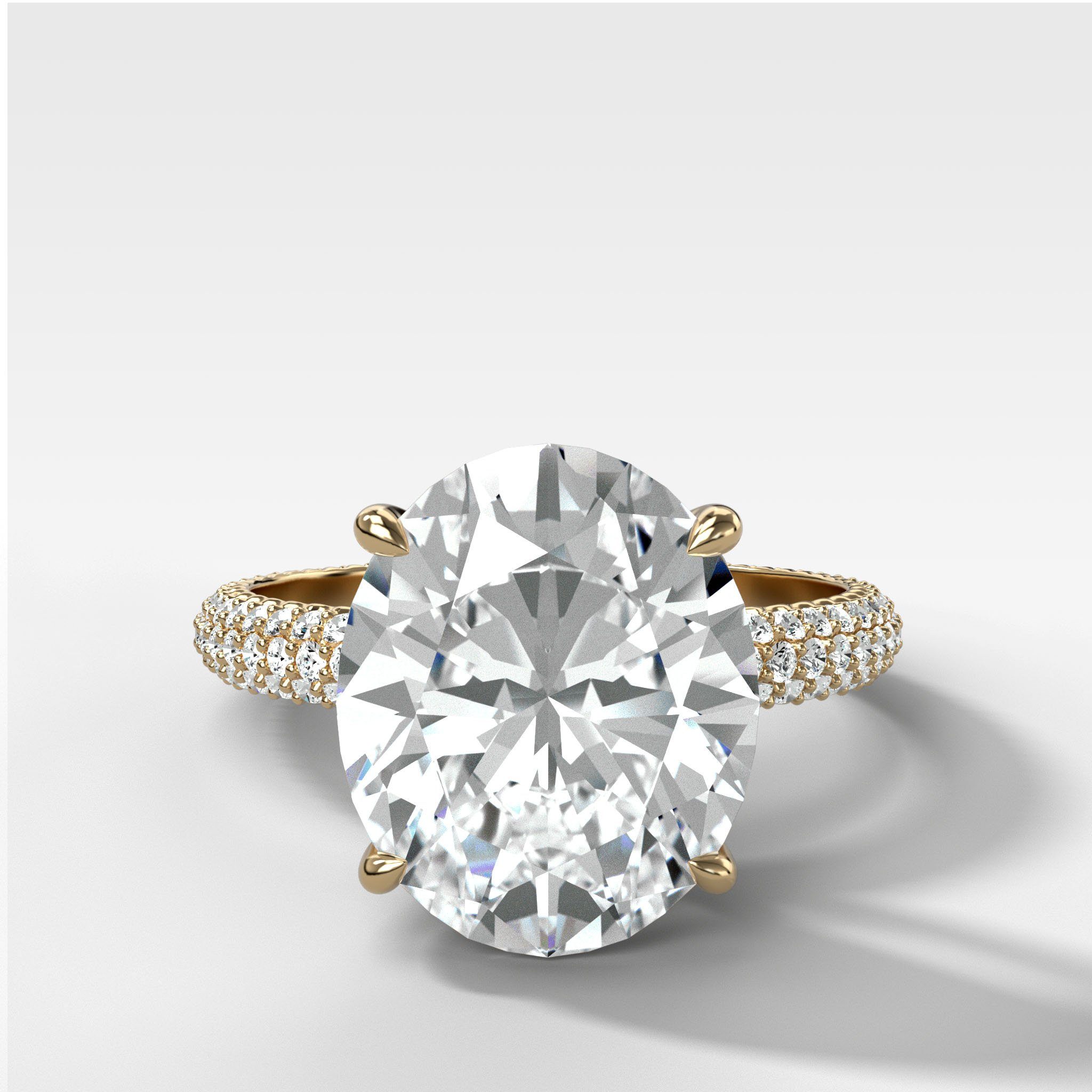 Triple Row Pavé Engagement Ring With Oval Cut Diamond