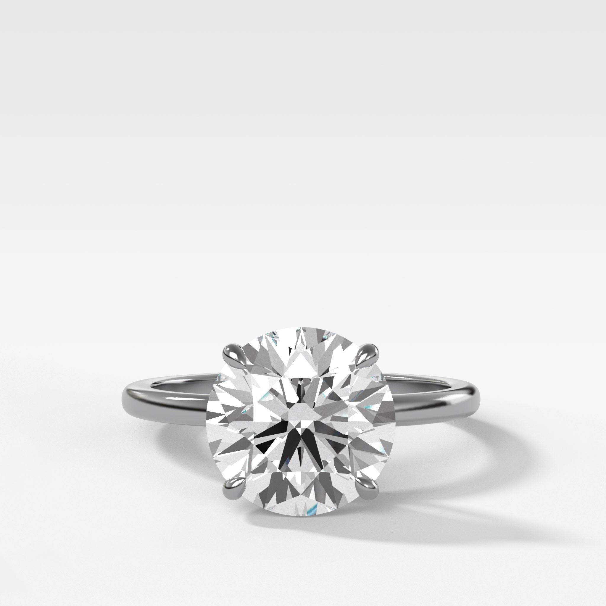 Crescent Solitaire Engagement Ring With Round Cut Diamond