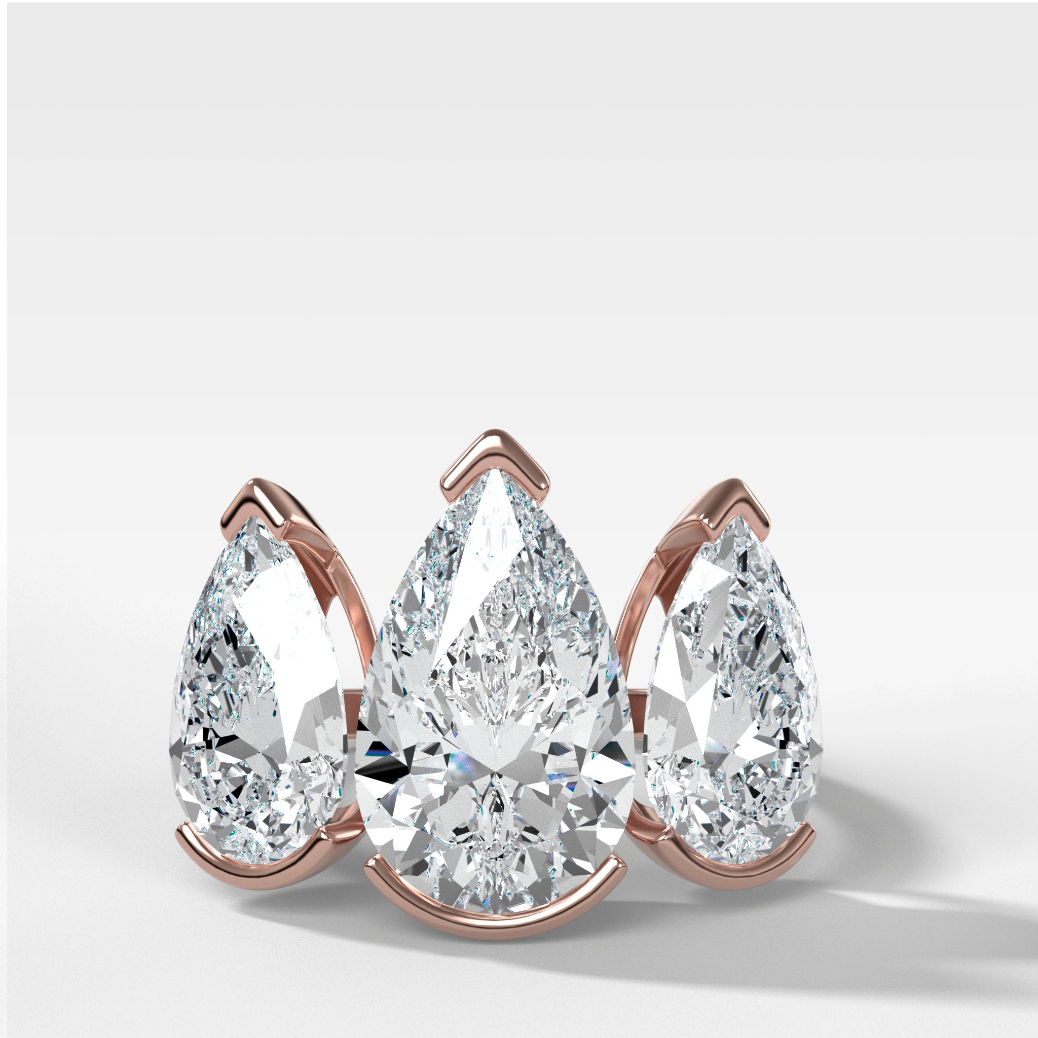 Half Bezel Triad Engagement Ring With Pear Cut Diamonds