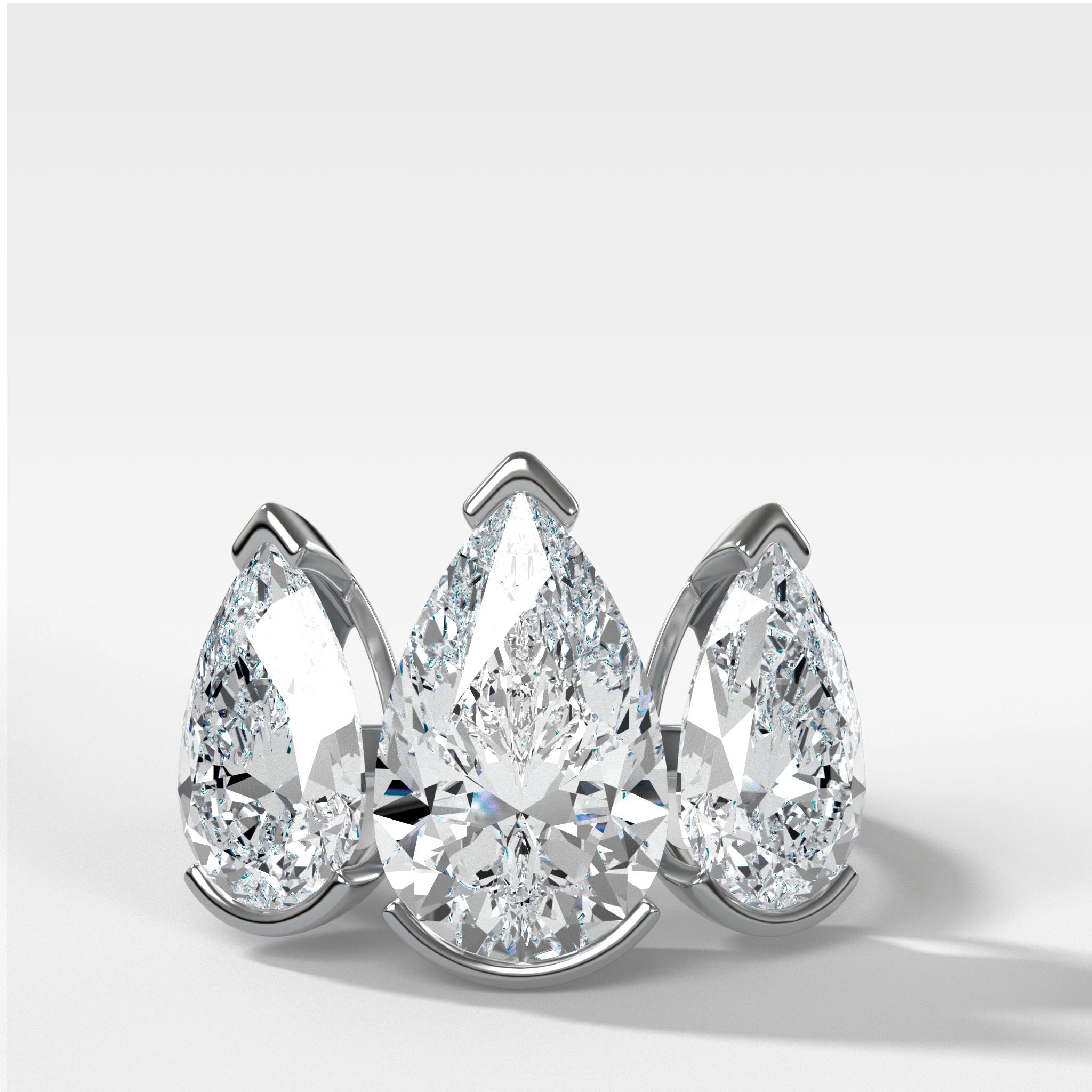 Half Bezel Triad Engagement Ring With Pear Cut Diamonds