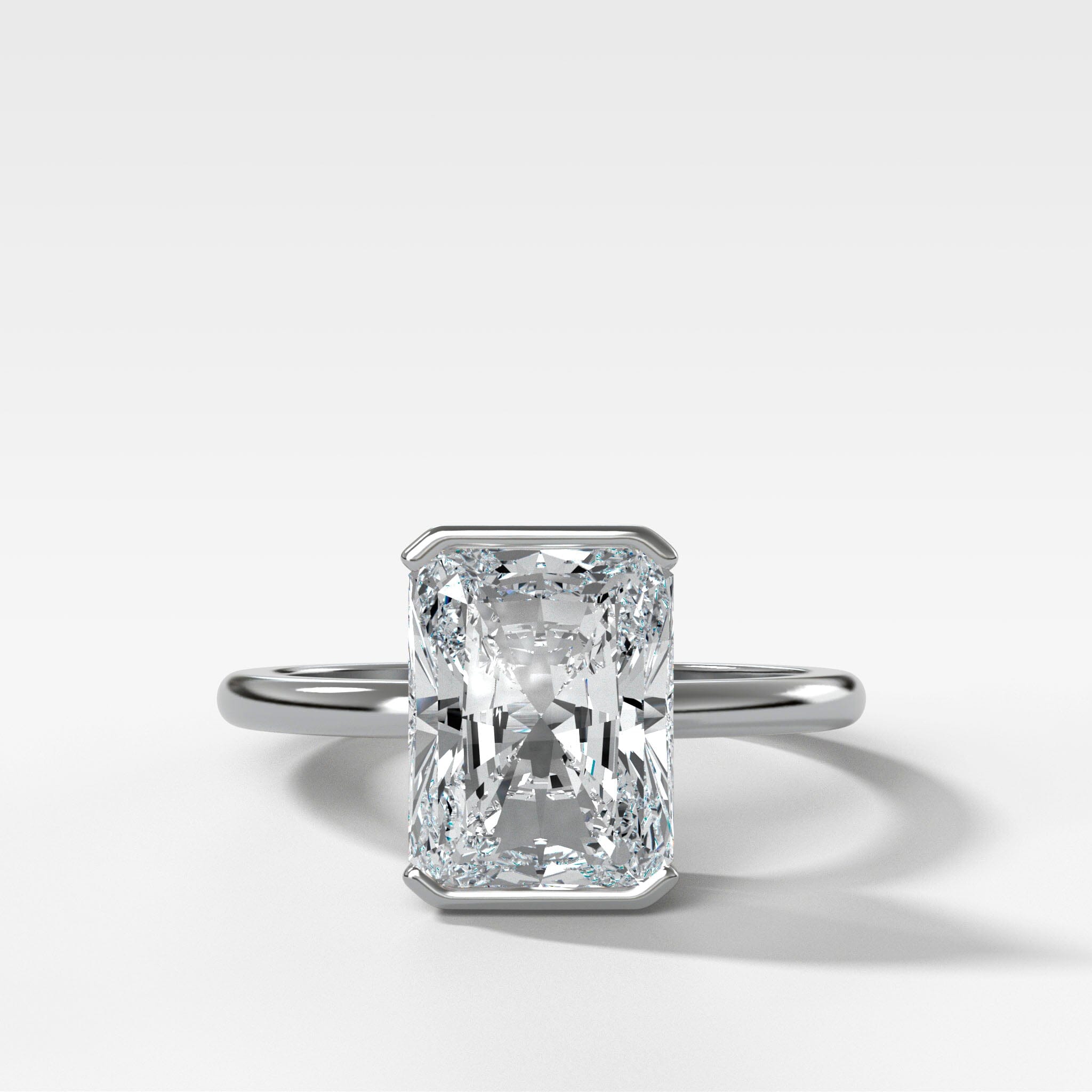 North South Half Bezel Solitaire Engagement Ring With Elongated Radiant Cut Diamond