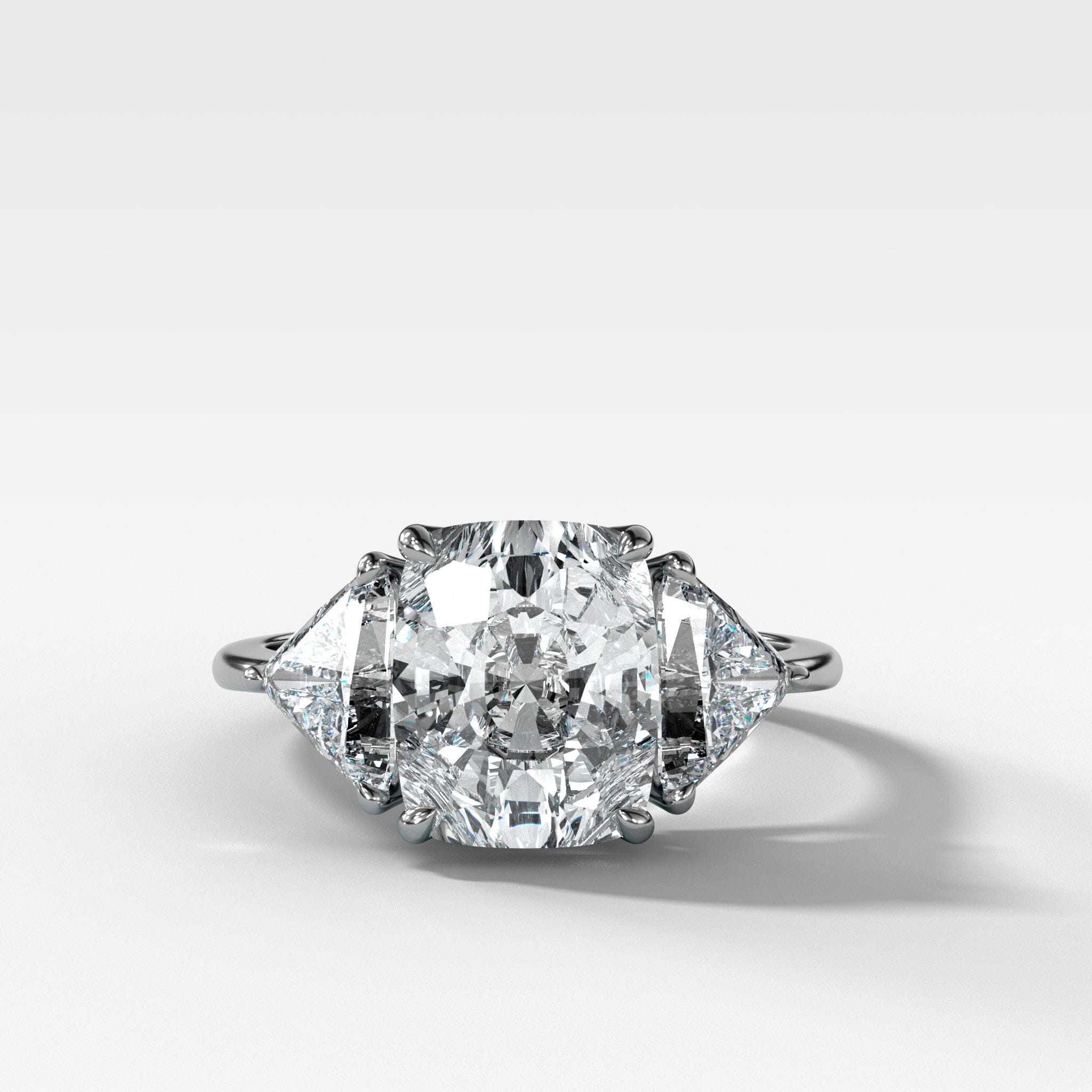 Three Stone Engagement Ring with Shield Side Stones and an Elongated Cushion cut Diamond