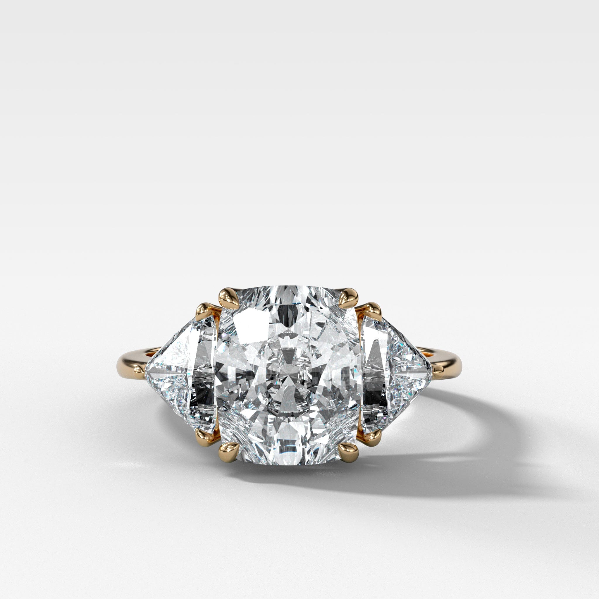 Three Stone Engagement Ring with Shield Side Stones and an Elongated Cushion cut Diamond