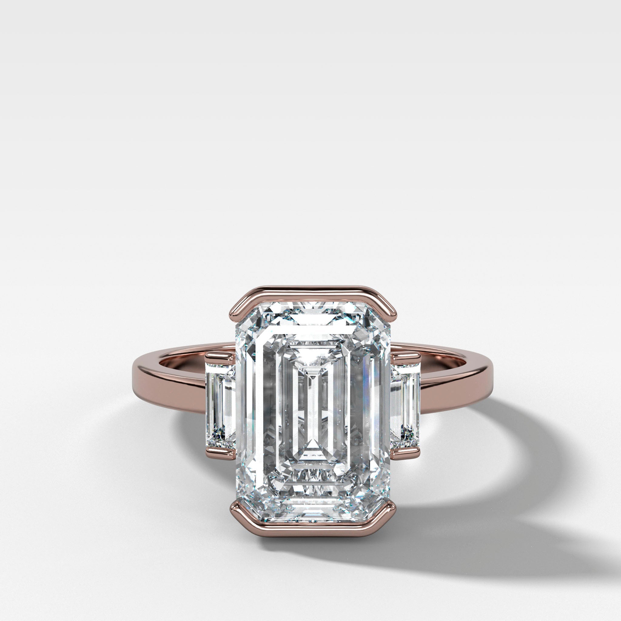 Three Stone Half Bezel Engagement Ring with Baguette Side Stones and Emerald Cut Diamond
