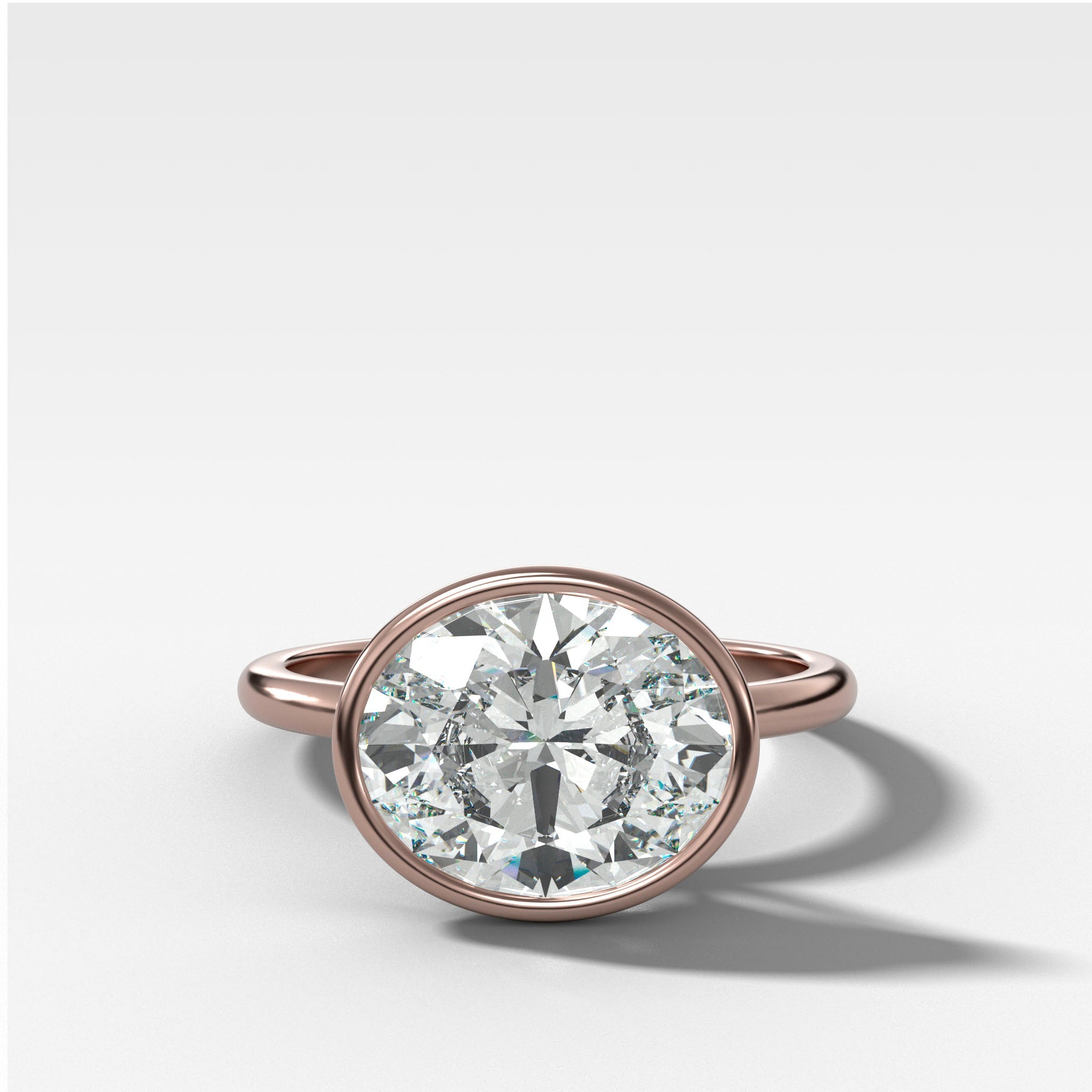 Penumbra Bezel Set Engagement Ring With East West Oval Cut
