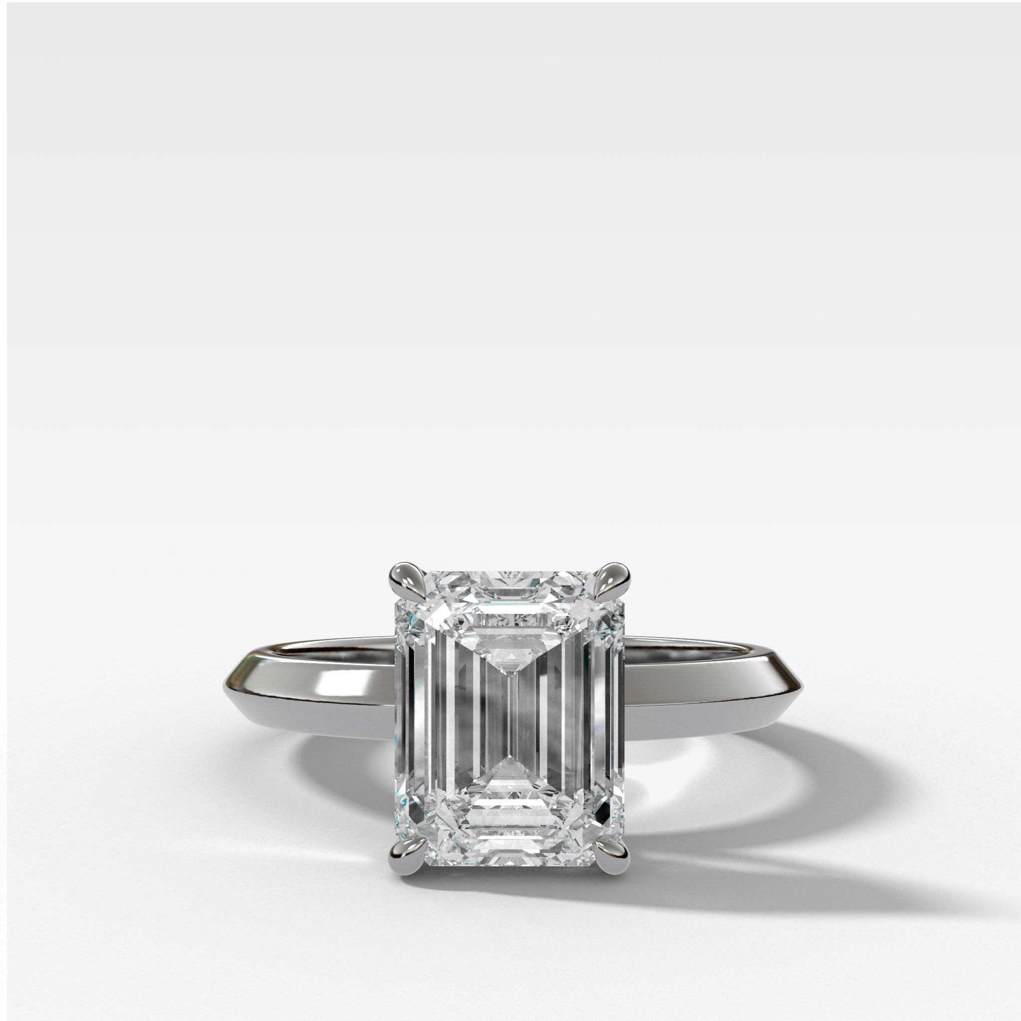 Butter Knife Solitaire Engagement Ring With Emerald Cut Diamond