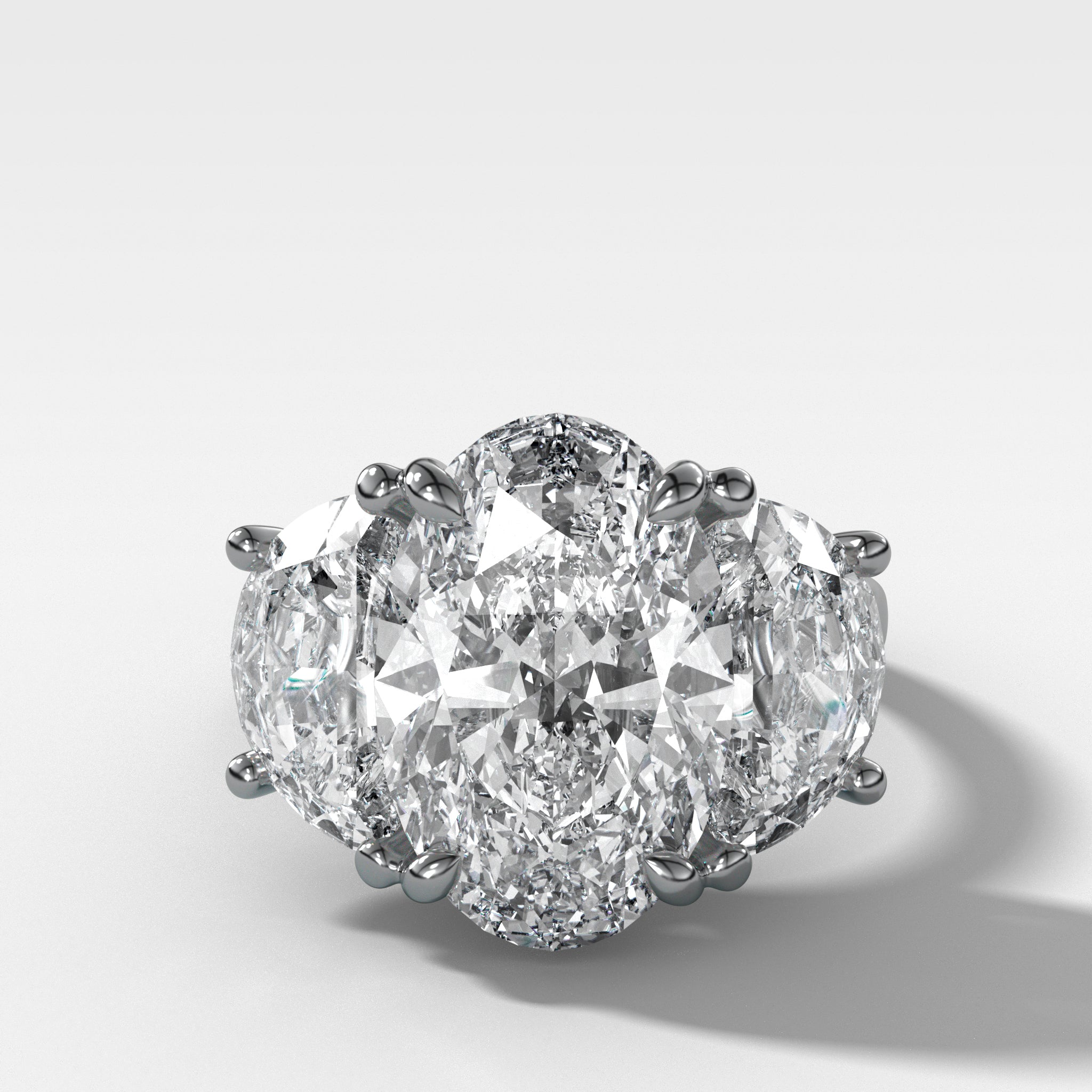 Jumbo Three Stone ring with Half Moon sides & an Oval Cut