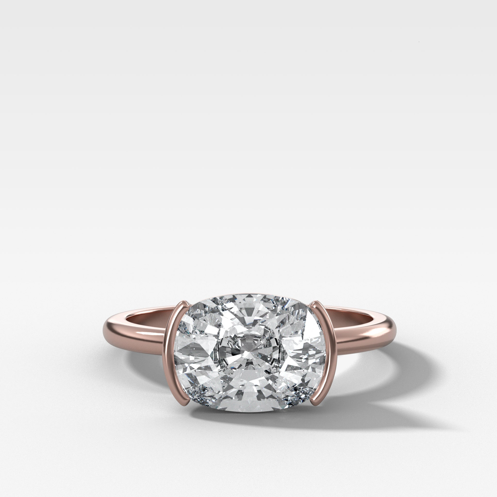 East West Half Bezel Solitaire Engagement Ring With Elongated Cushion Cut Diamond