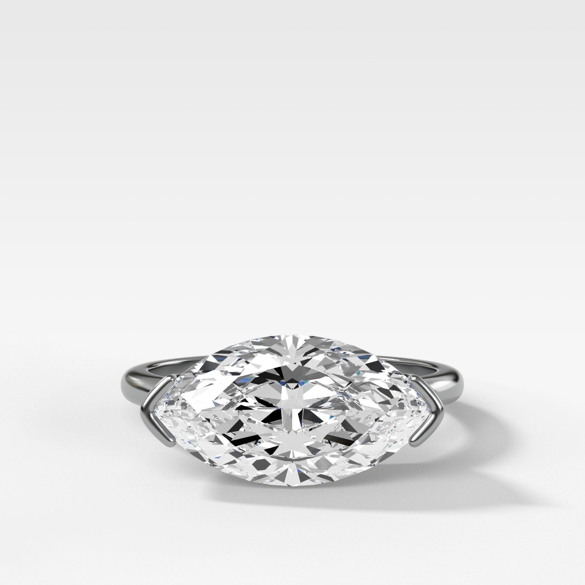 East West Half Bezel Solitaire Engagement Ring With Marquise Cut Diamond