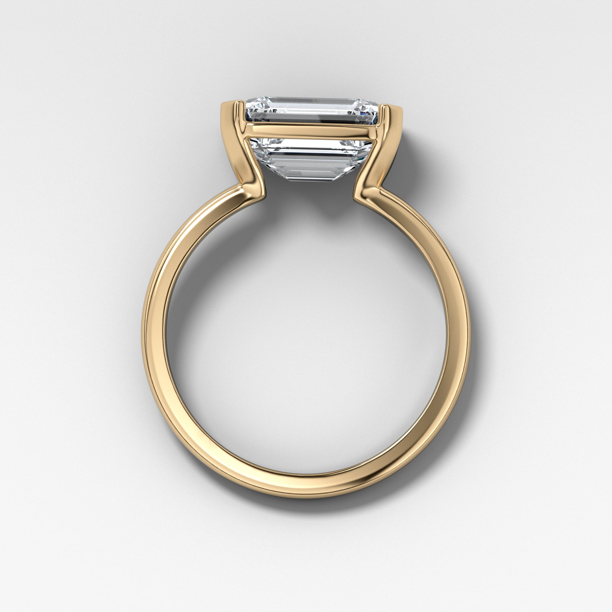 East West Half Bezel Solitaire Engagement Ring With Emerald Cut Diamond
