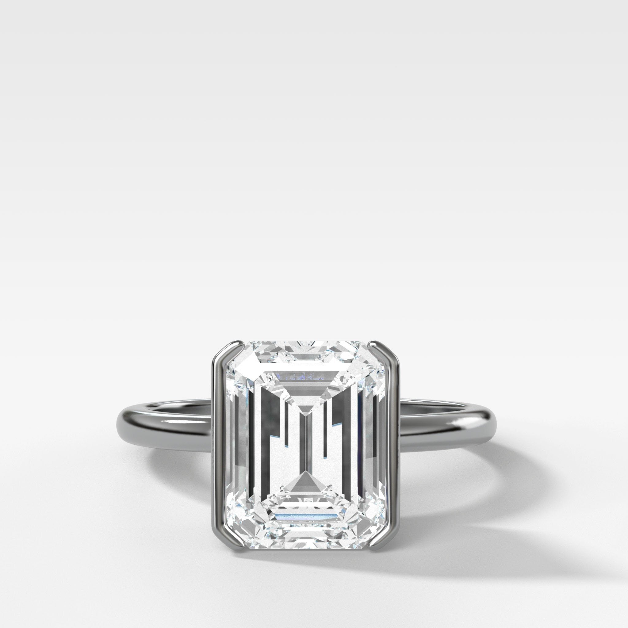North South Half Bezel Solitaire Engagement Ring With Emerald Cut Diamond
