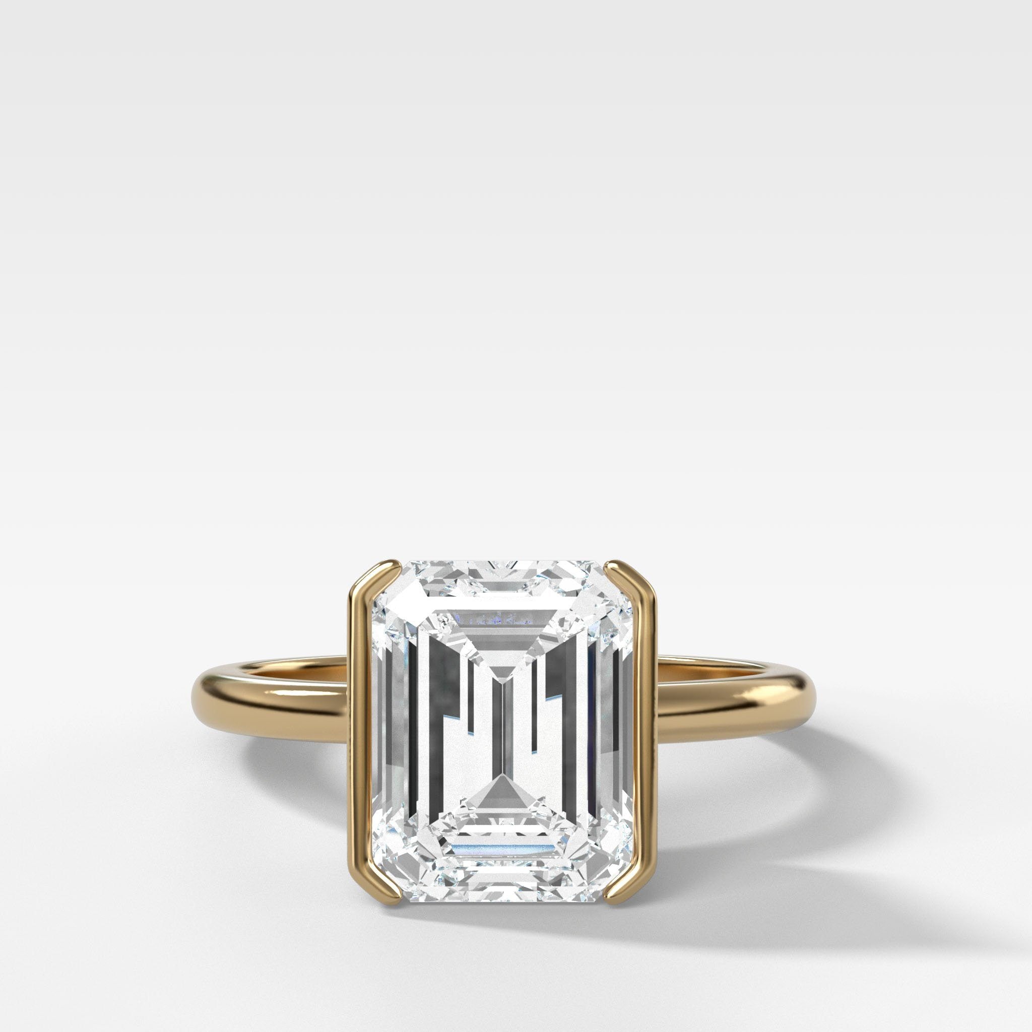 North South Half Bezel Solitaire Engagement Ring With Emerald Cut Diamond
