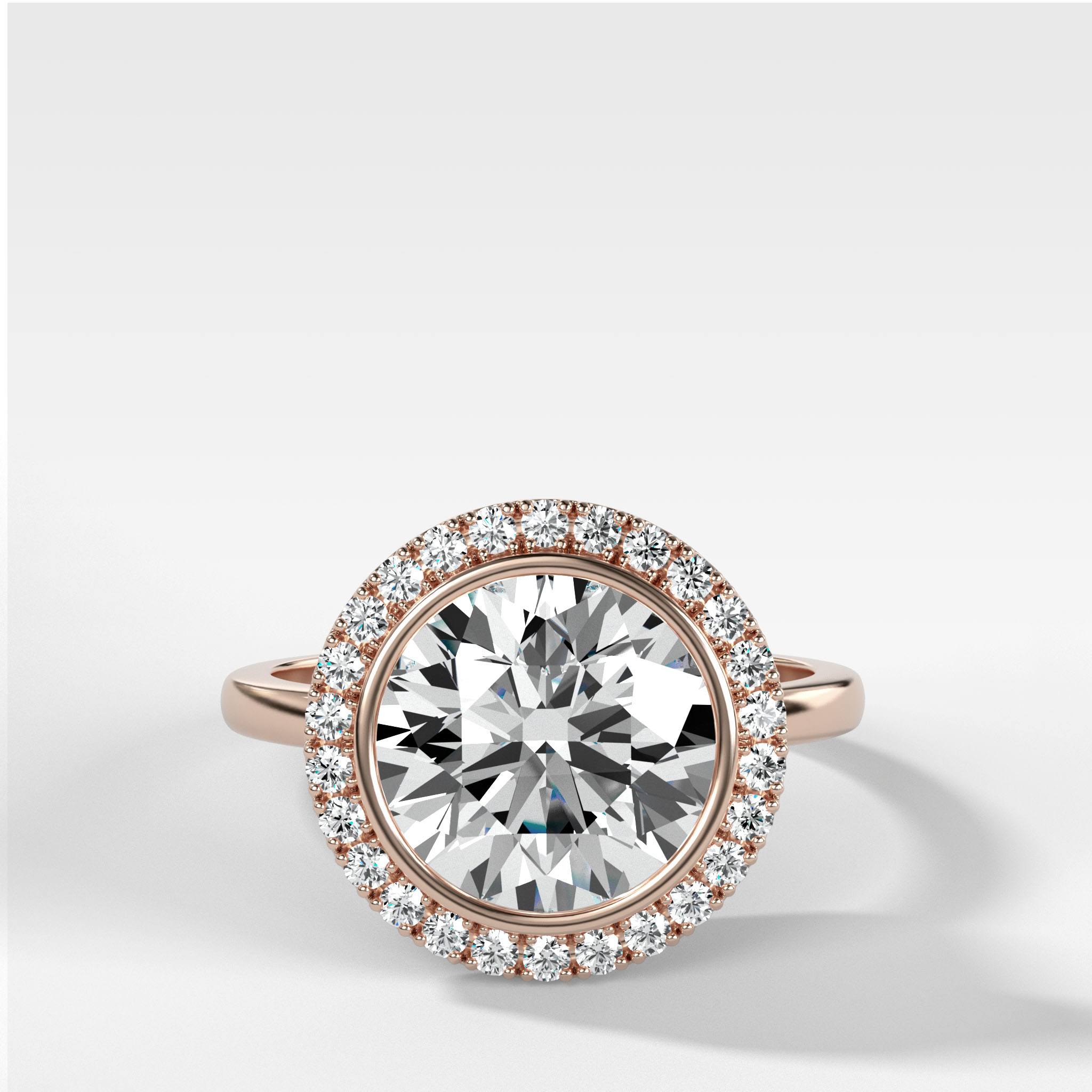 Bezel Set Halo Engagement Ring With Round Cut Diamond