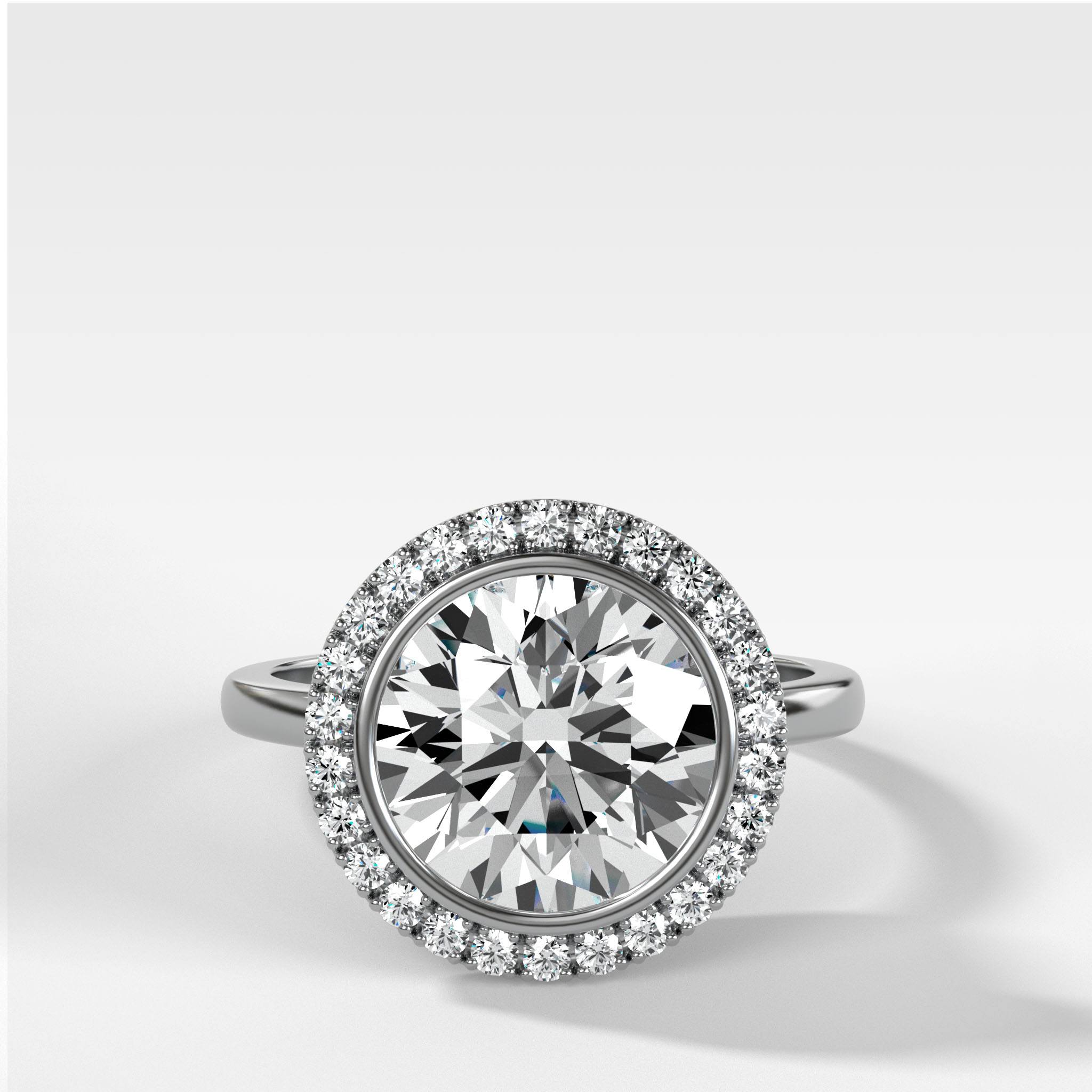 Bezel Set Halo Engagement Ring With Round Cut Diamond
