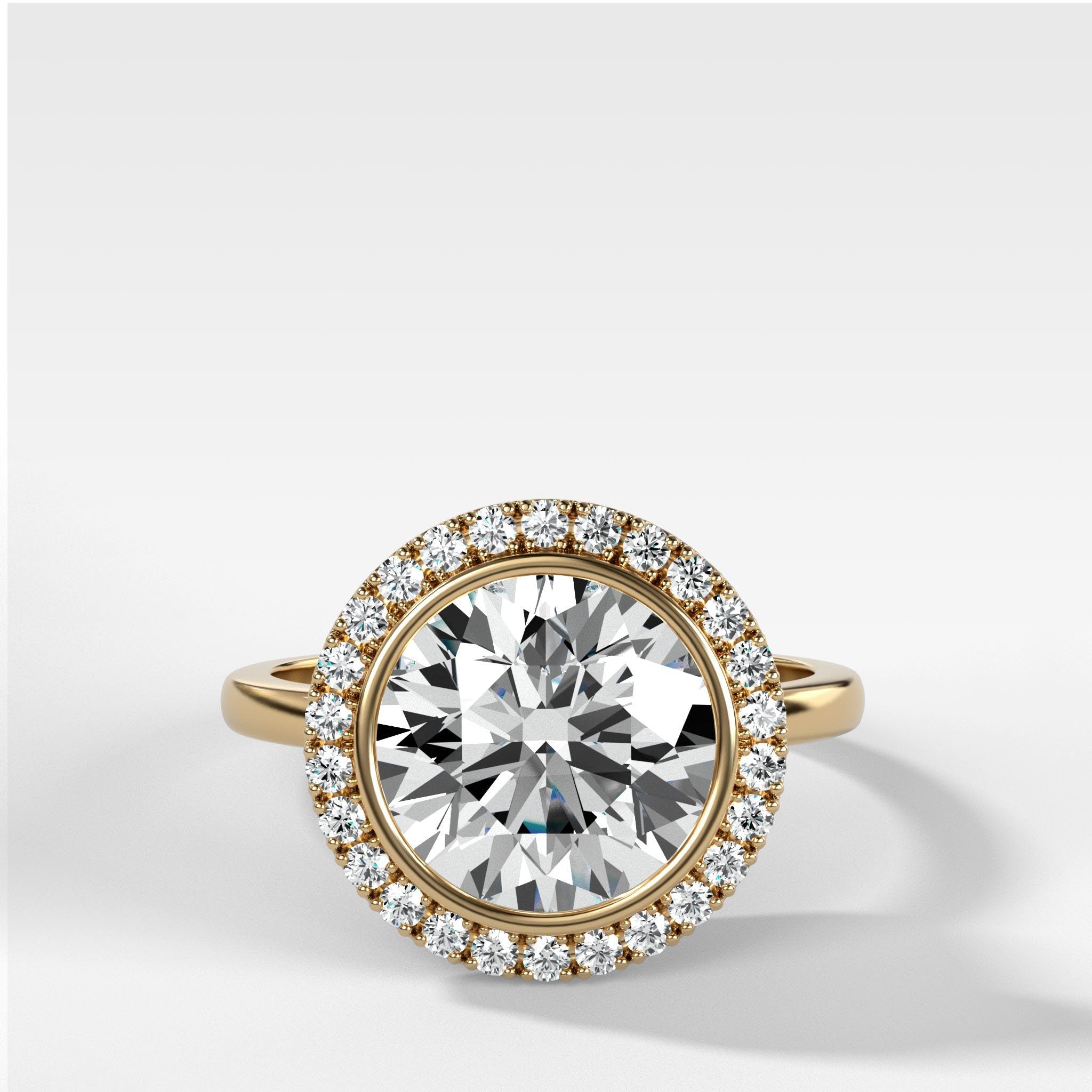 Bezel Set Halo Engagement Ring With Round Cut Diamond