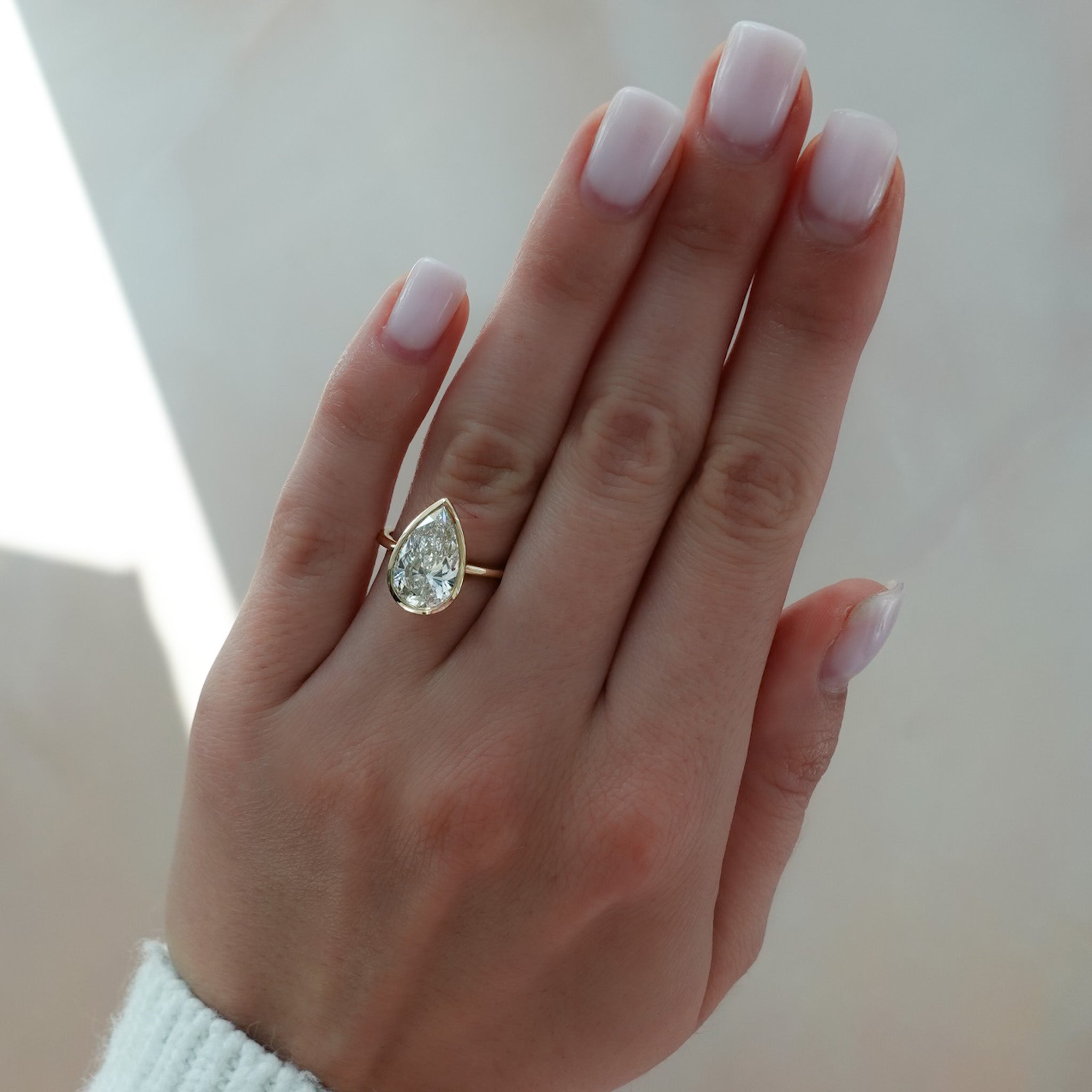 Penumbra Bezel Set Engagement Ring With Pear Cut