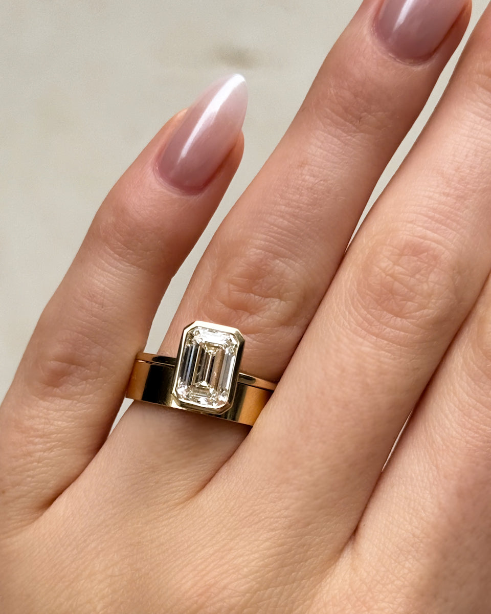 Penumbra Bezel Set Engagement Ring With Emerald Cut