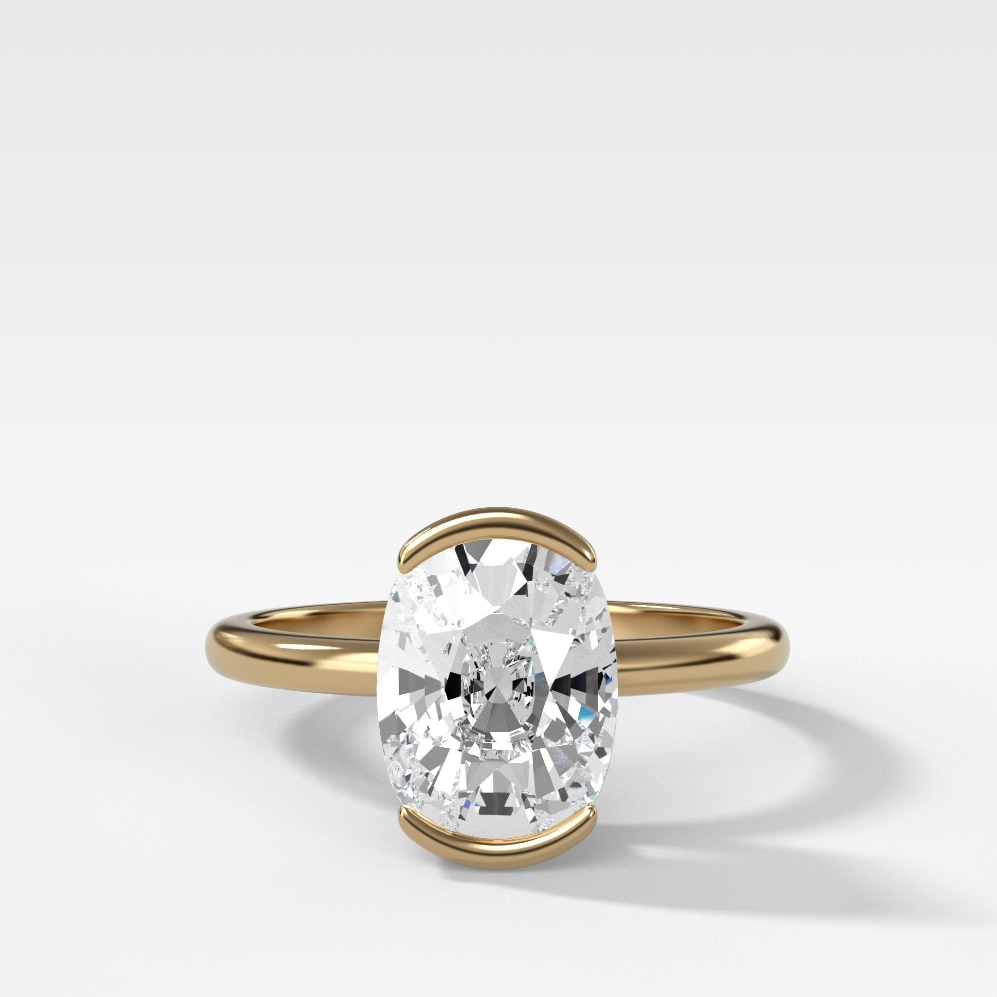 North South Half Bezel Solitaire Engagement Ring With Elongated Cushion Cut Diamond