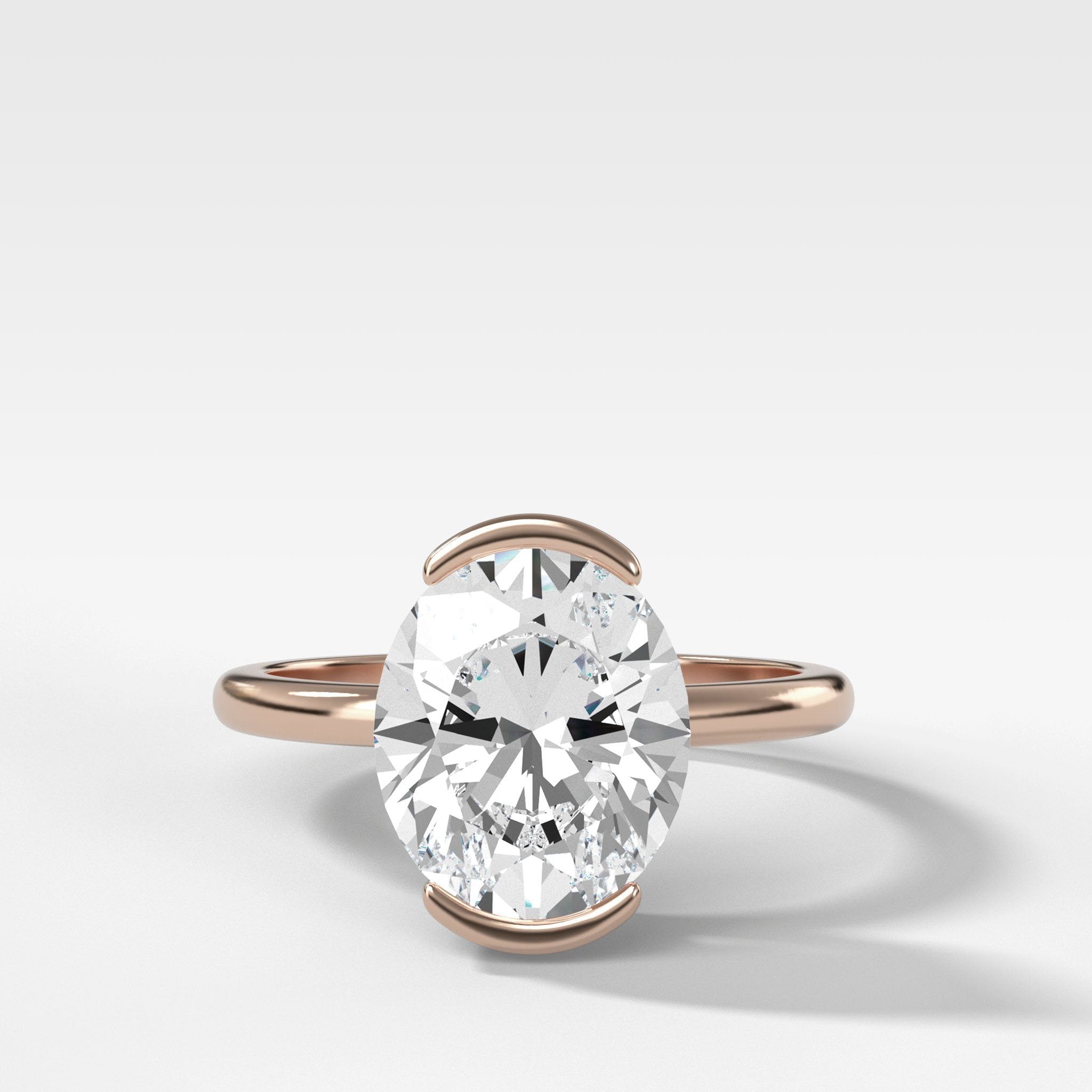 North South Half Bezel Solitaire Engagement Ring With Oval Cut Diamond