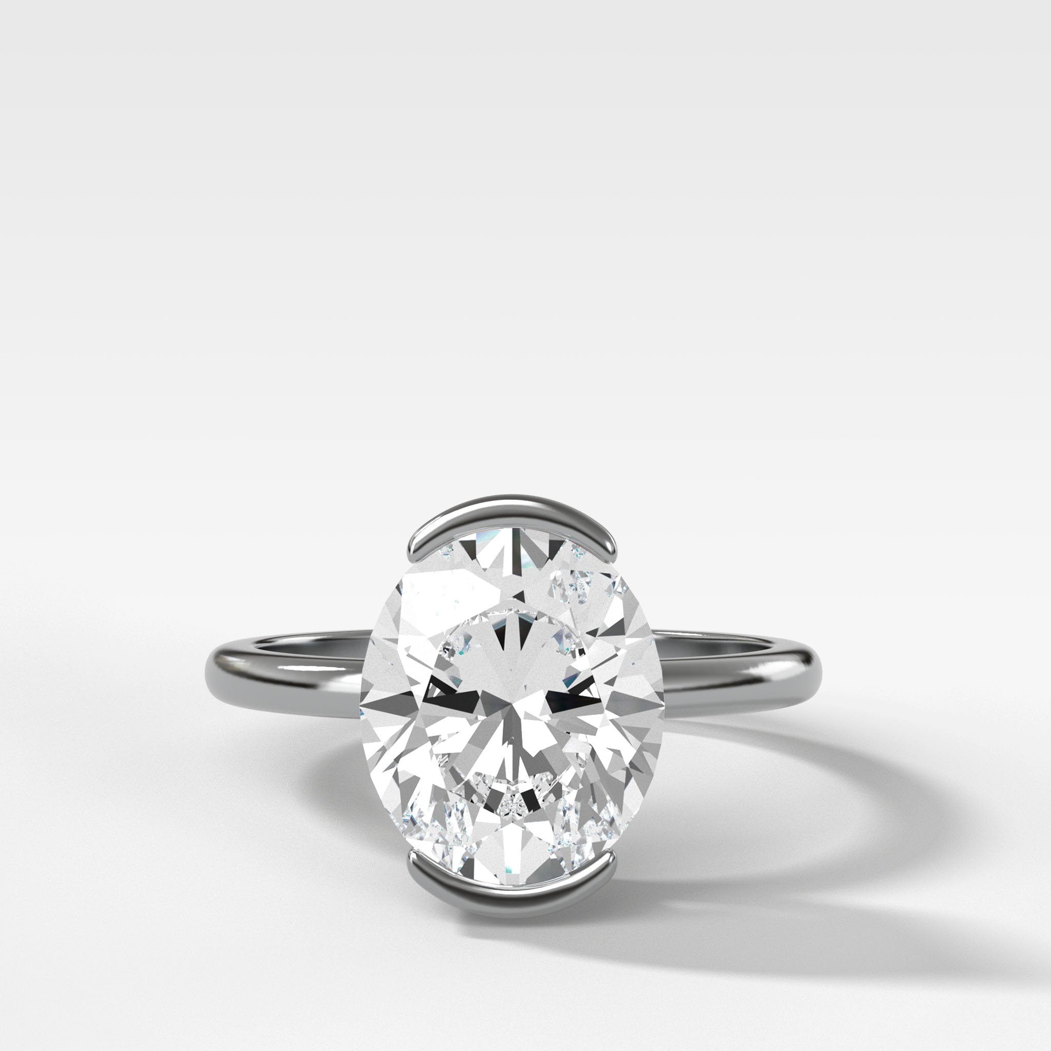 North South Half Bezel Solitaire Engagement Ring With Oval Cut Diamond