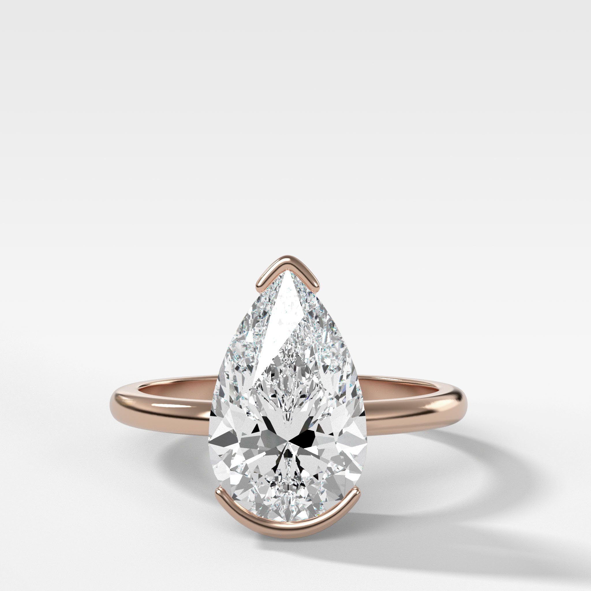North South Half Bezel Solitaire Engagement Ring With Pear Cut Diamond