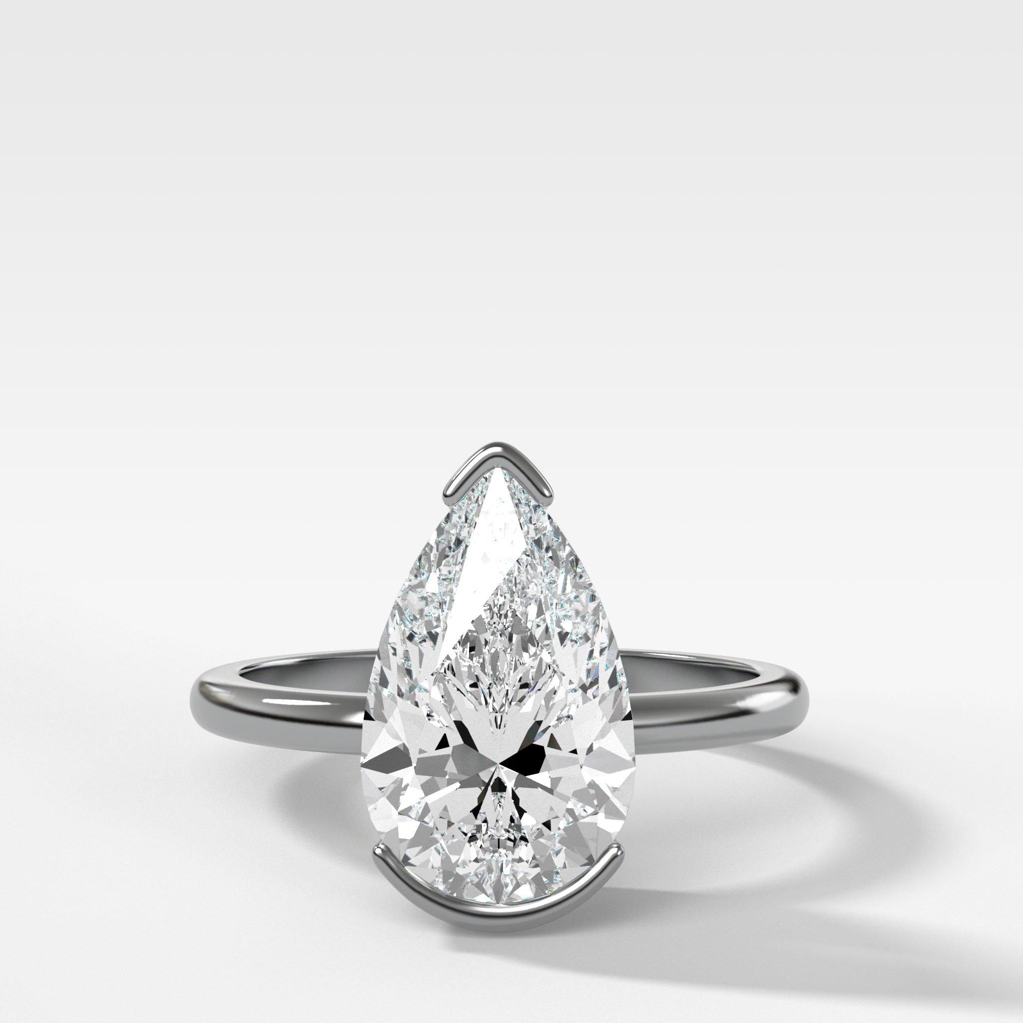 North South Half Bezel Solitaire Engagement Ring With Pear Cut Diamond