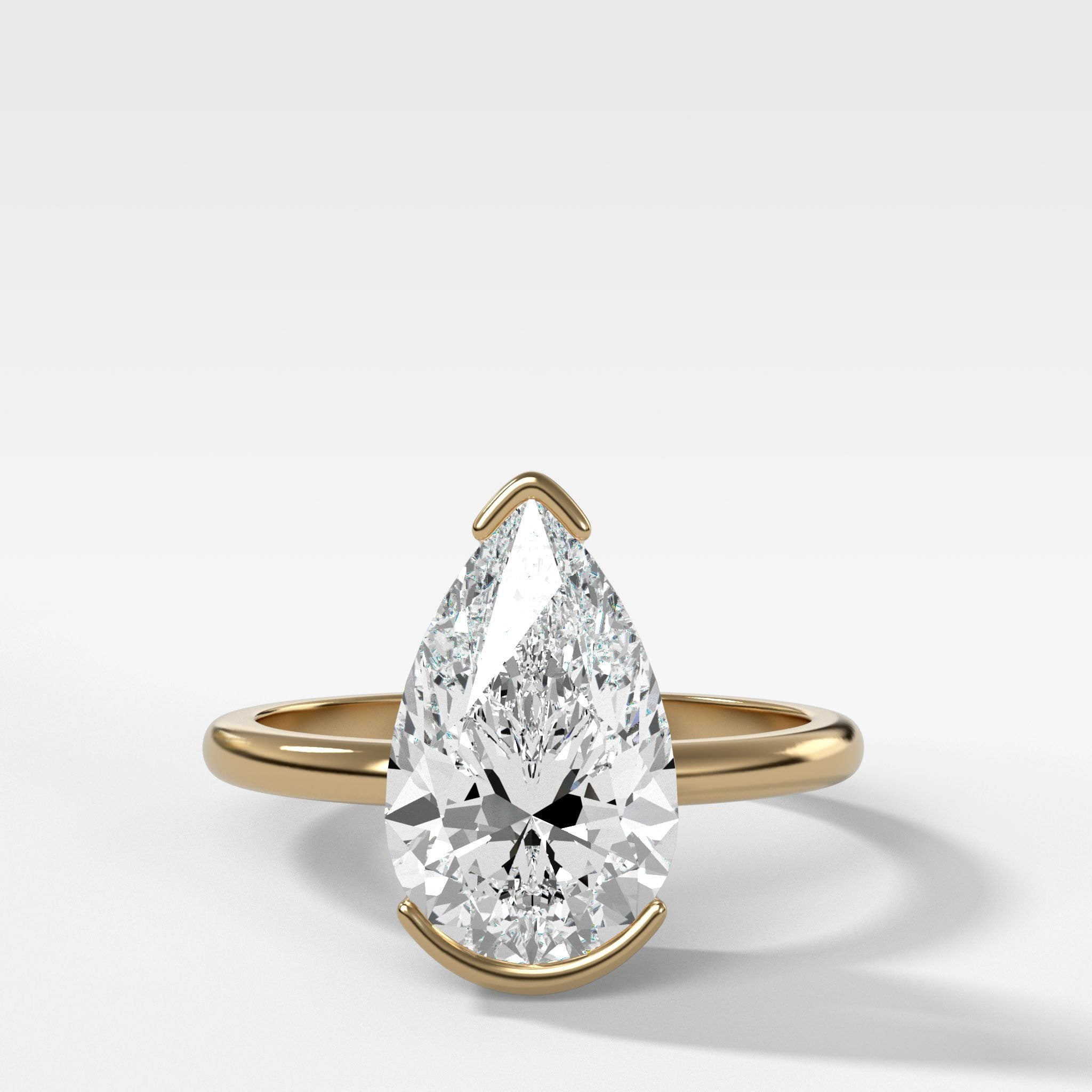 North South Half Bezel Solitaire Engagement Ring With Pear Cut Diamond