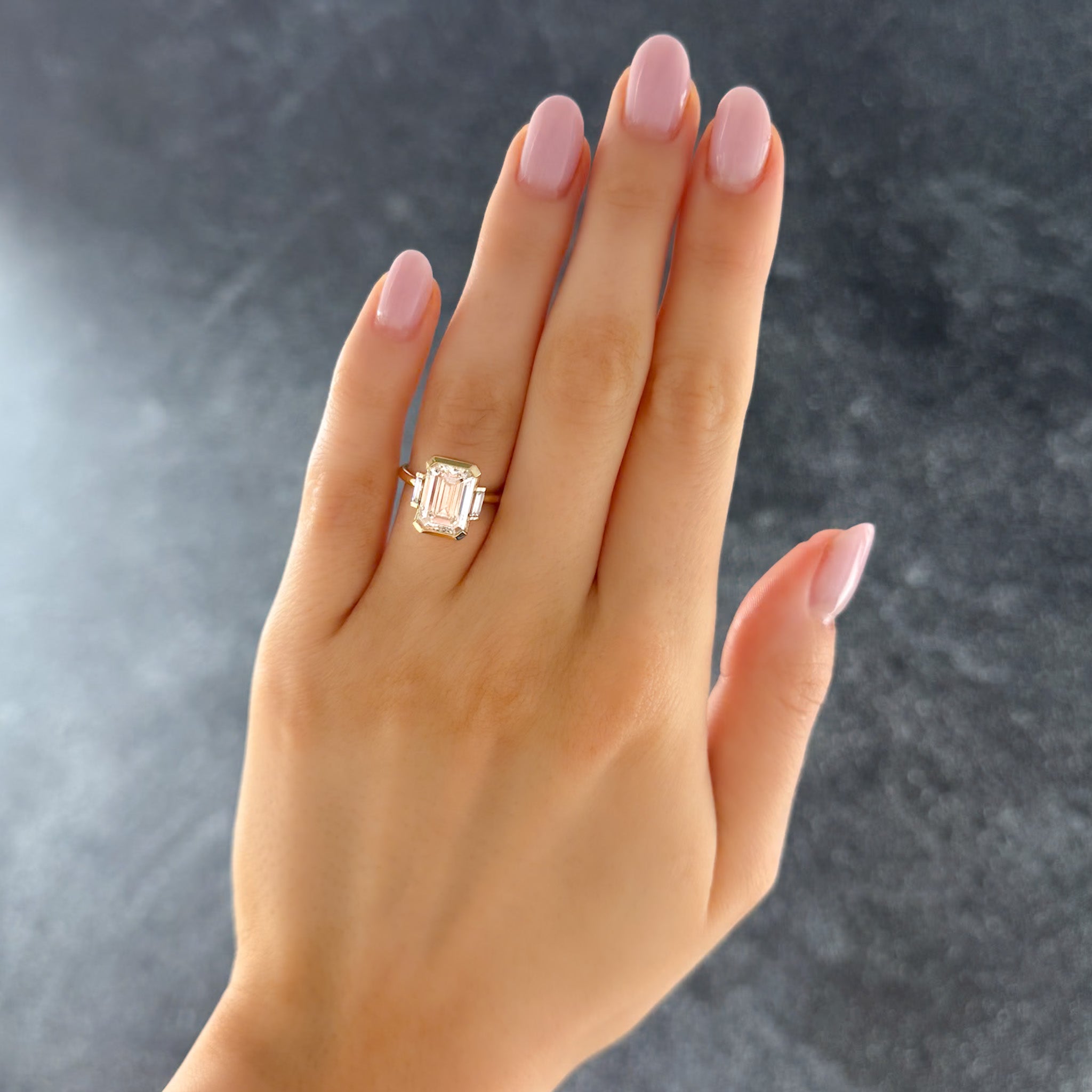 Three Stone Half Bezel Engagement Ring with Baguette Side Stones and Emerald Cut Diamond