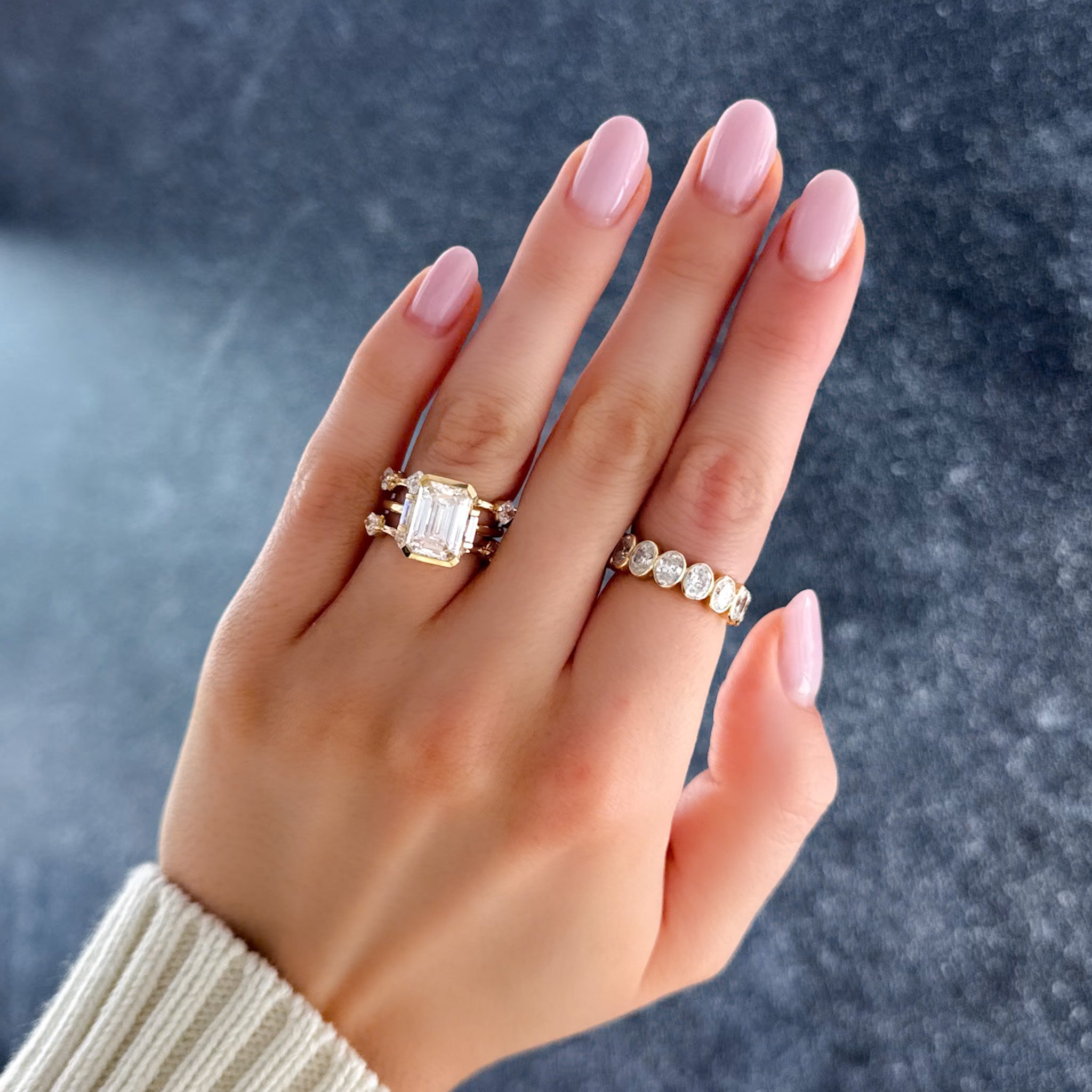 Three Stone Half Bezel Engagement Ring with Baguette Side Stones and Emerald Cut Diamond