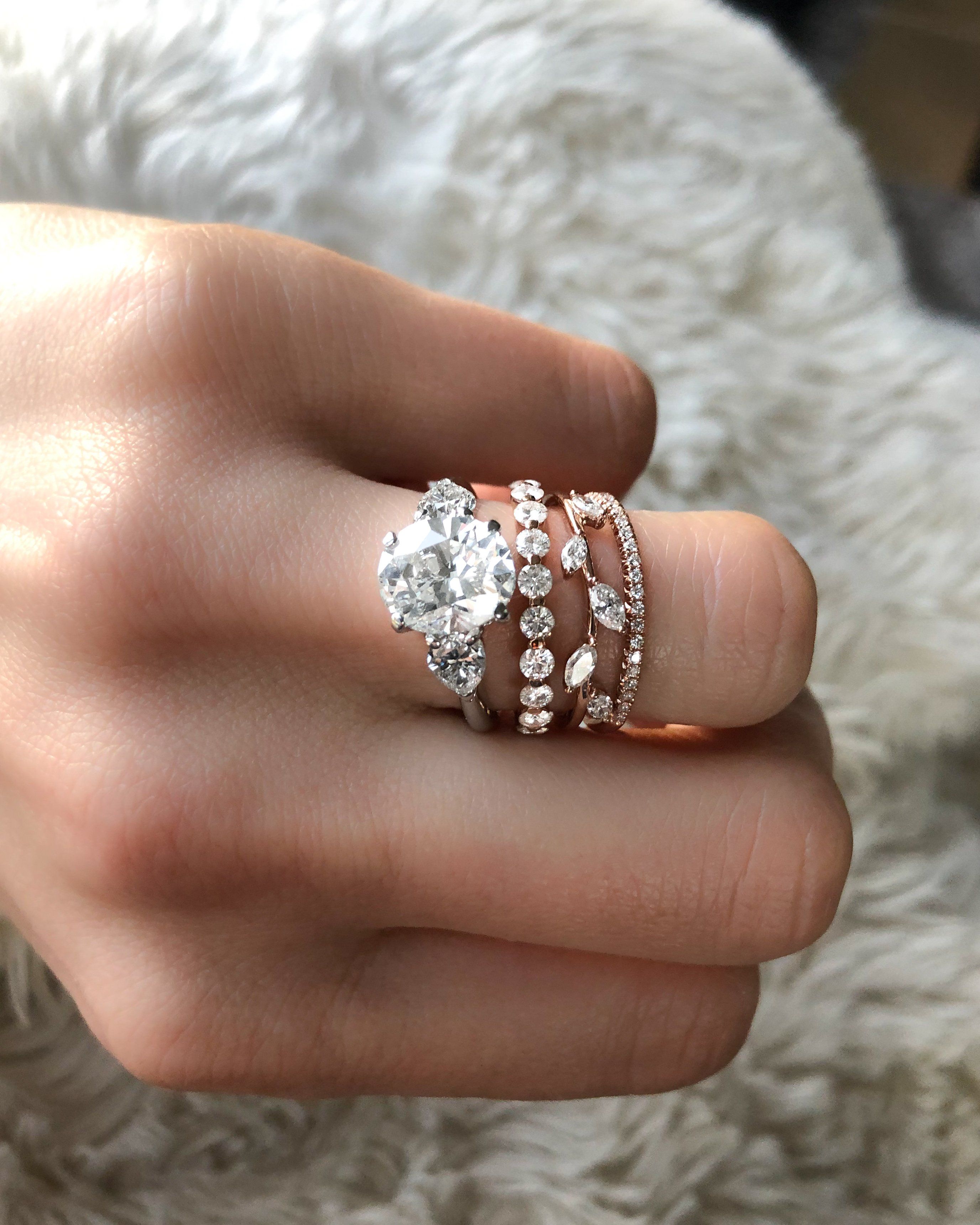 Three Stone Engagement Ring With Pear Side Stones and Oval Cut Diamond