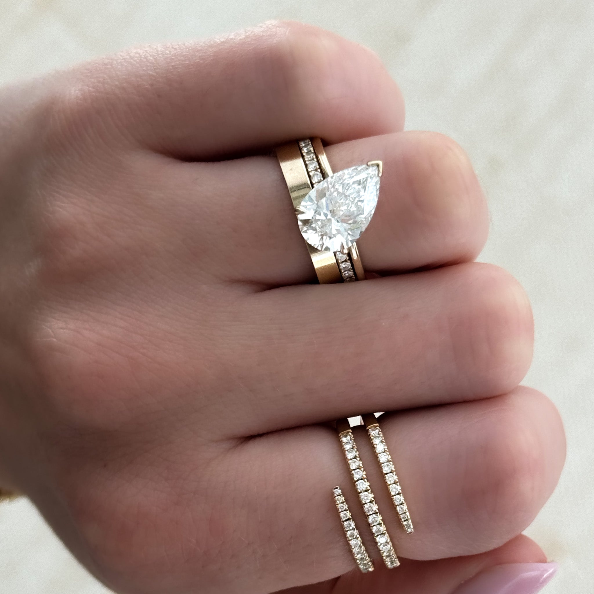 Tilted Thin + Simple Solitaire Engagement Ring With Pear Cut Diamond