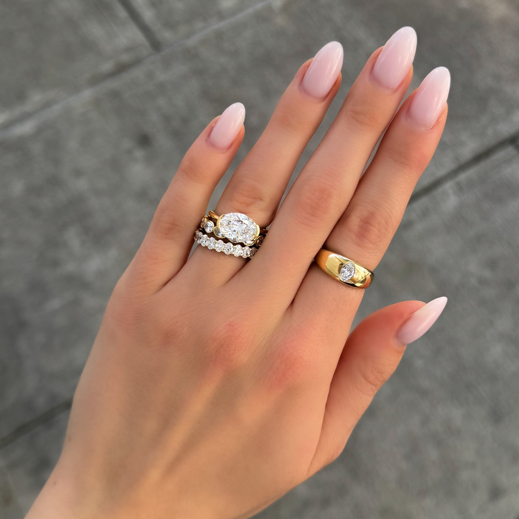 East West Half Bezel Solitaire Engagement Ring With Oval Cut Diamond