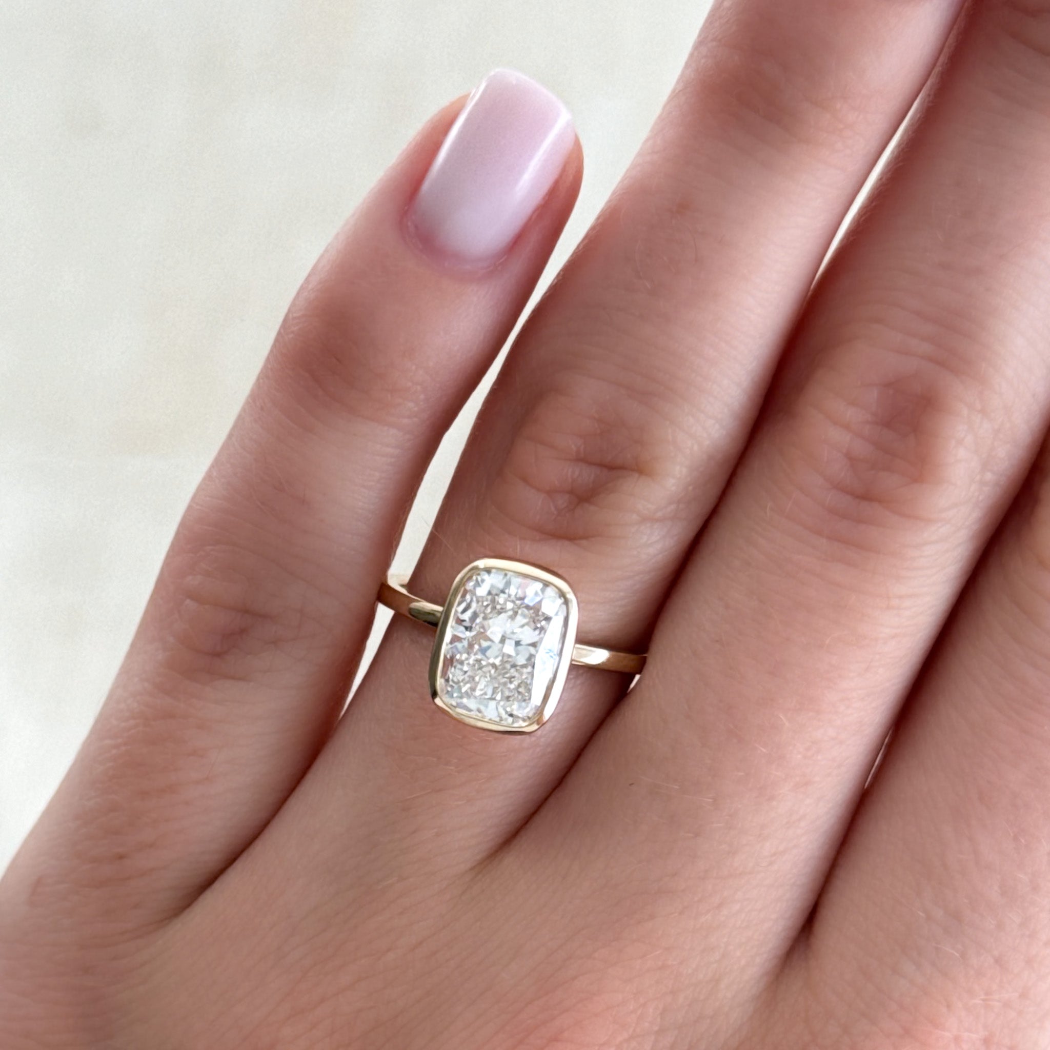 Penumbra Bezel Set Engagement Ring With Elongated Cushion Cut