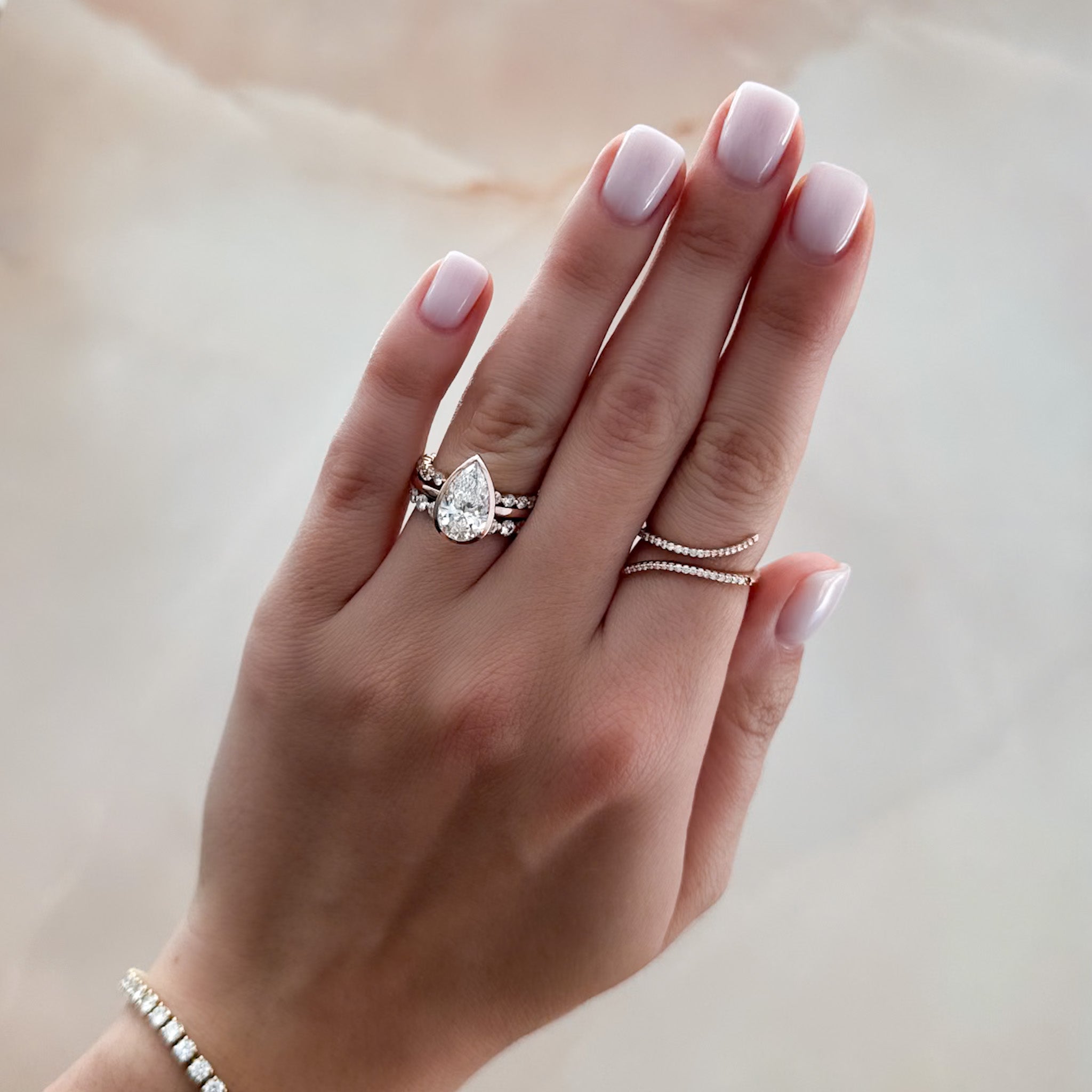 Penumbra Bezel Set Engagement Ring With Pear Cut