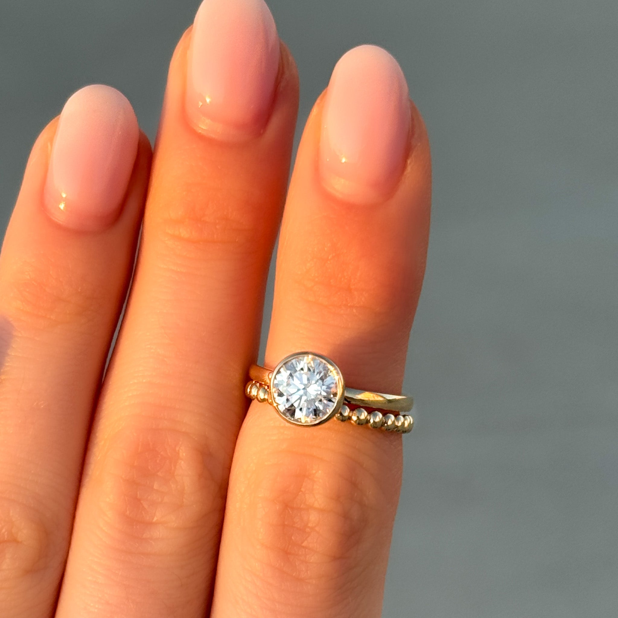 Penumbra Bezel Set Engagement Ring With Round Cut