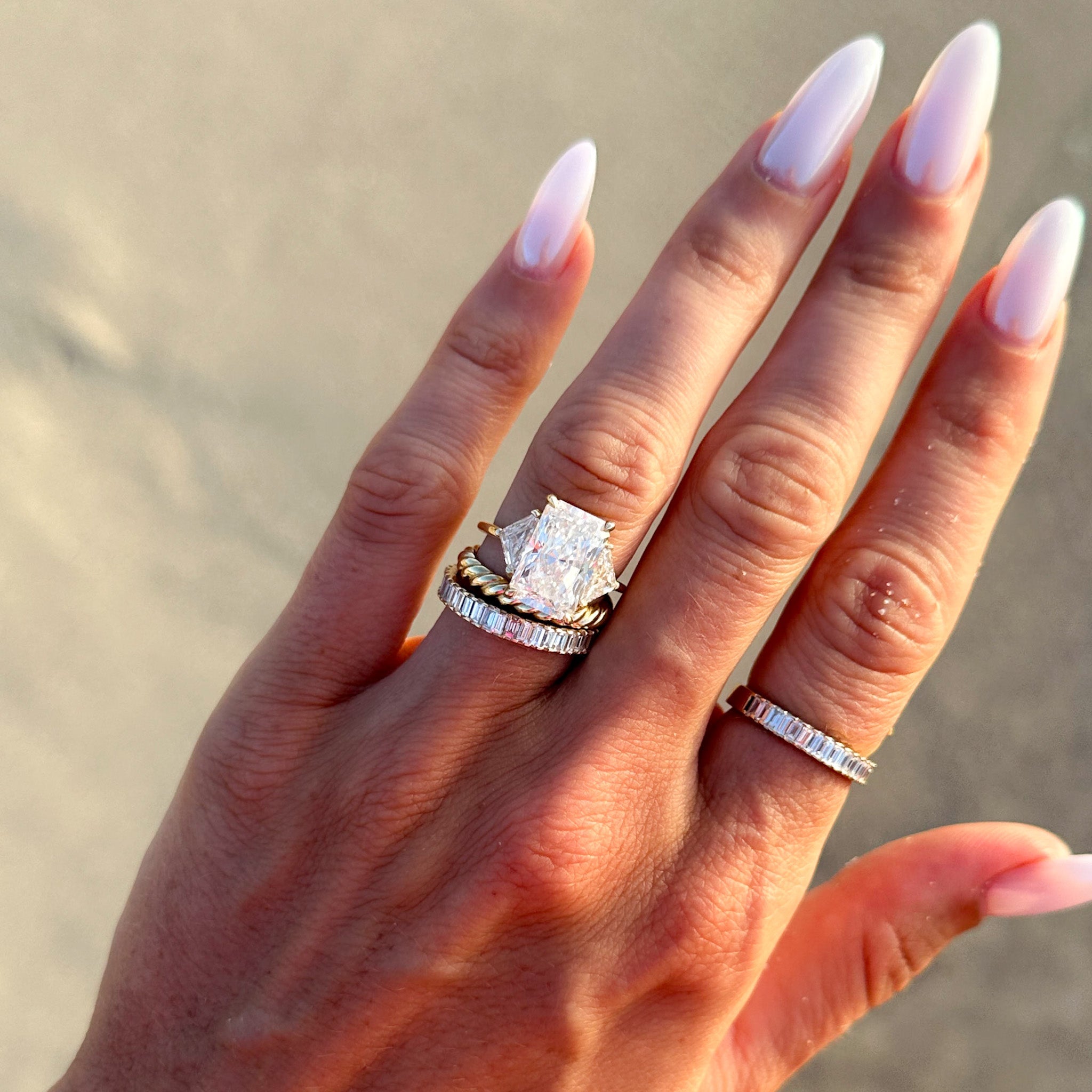 Three Stone Engagement Ring with Shield Side Stones and a Radiant cut Diamond